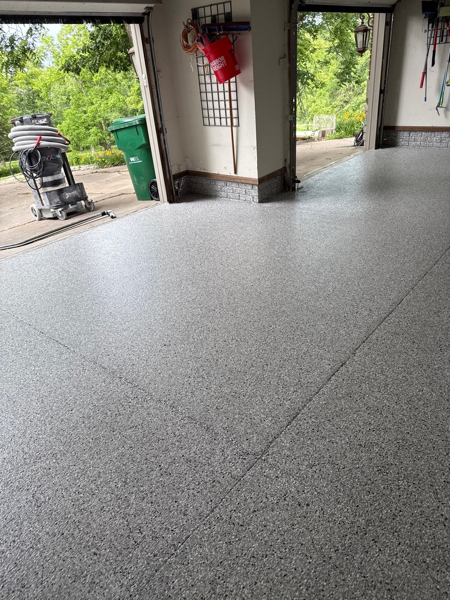 Coyote Flake Epoxy Garage Floor Coating in Earlham by Revival Concrete Coatings