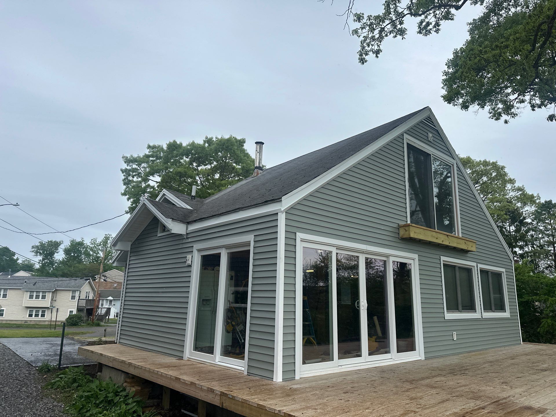 Milford Exterior Renovation Featuring Custom Siding and Wood Deck Installation by A Plus Exterior