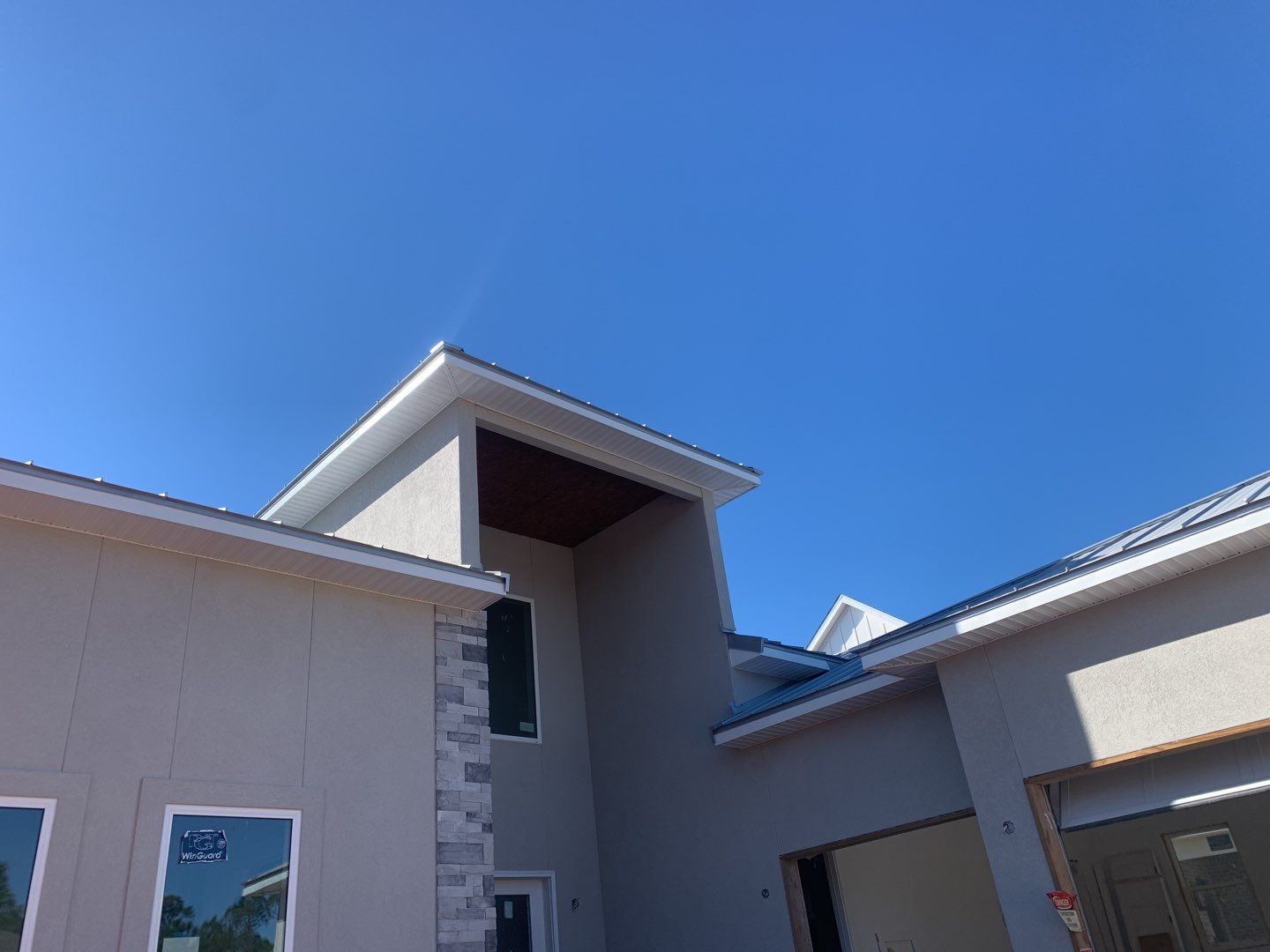 Soffit and Fascia Installation using White Vinyl Soffit in Pensacola FL by Gutter Professors