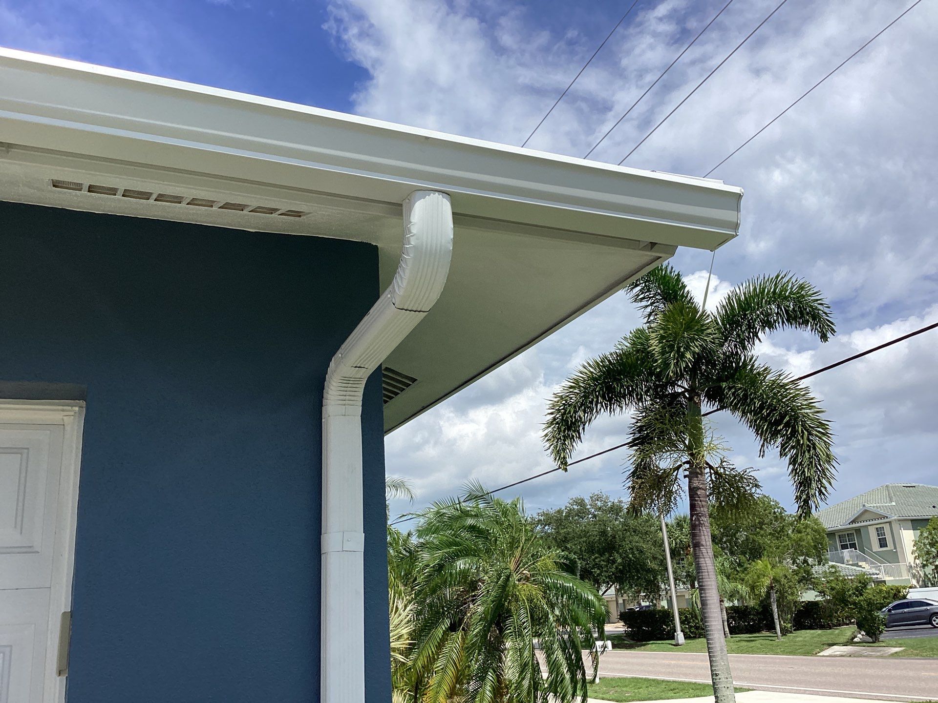 White Downspouts and Gutters Combo in Punta Gorda FL by Gutter Professors