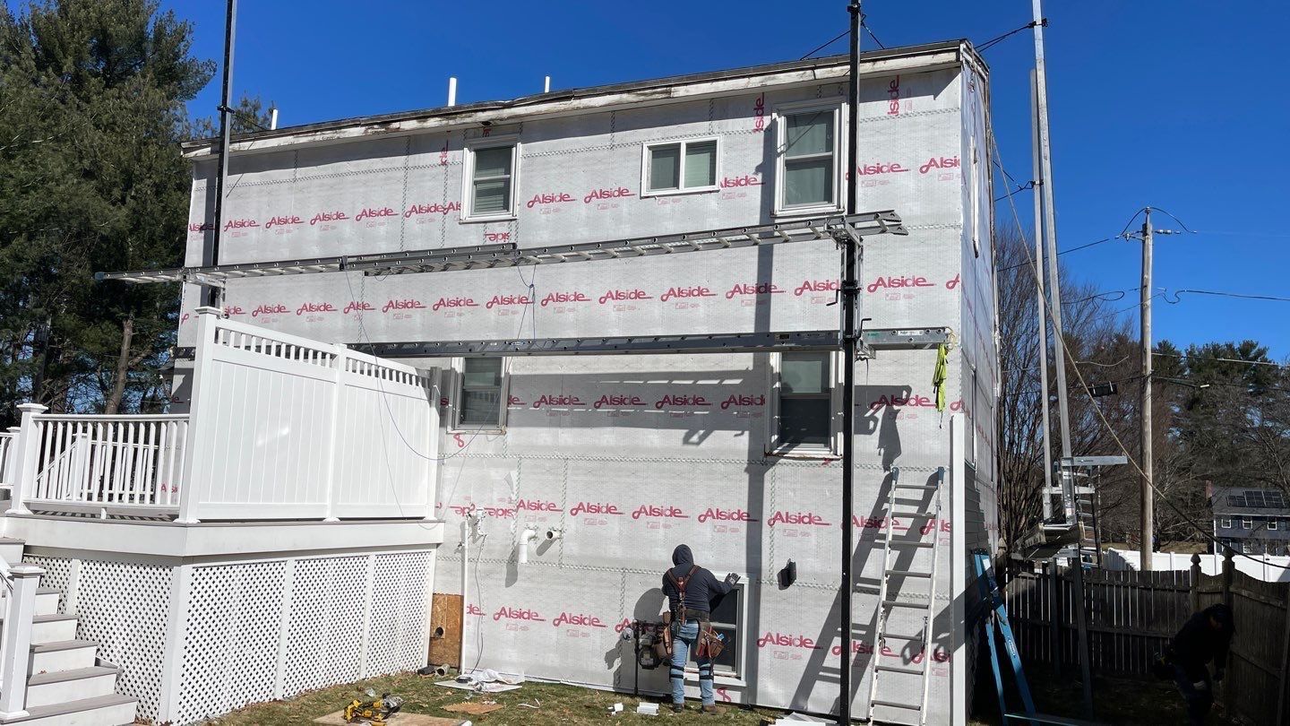 Complete Exterior Renovation with New Siding & Gutters   by Sensible Home Solutions