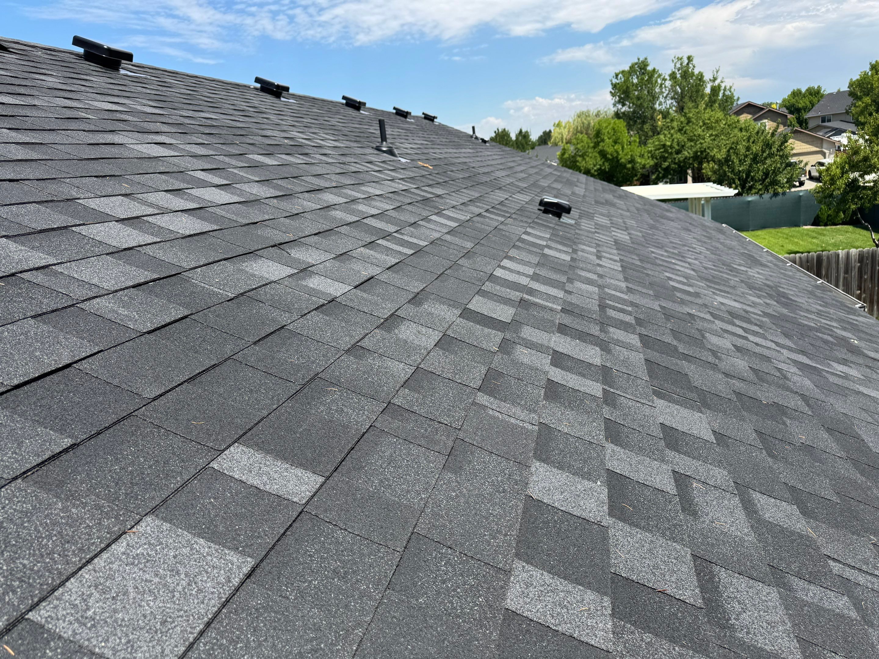 Residential Roof Replacement Featuring Charcoal Grey Architectural Shingles by Olive Roofing