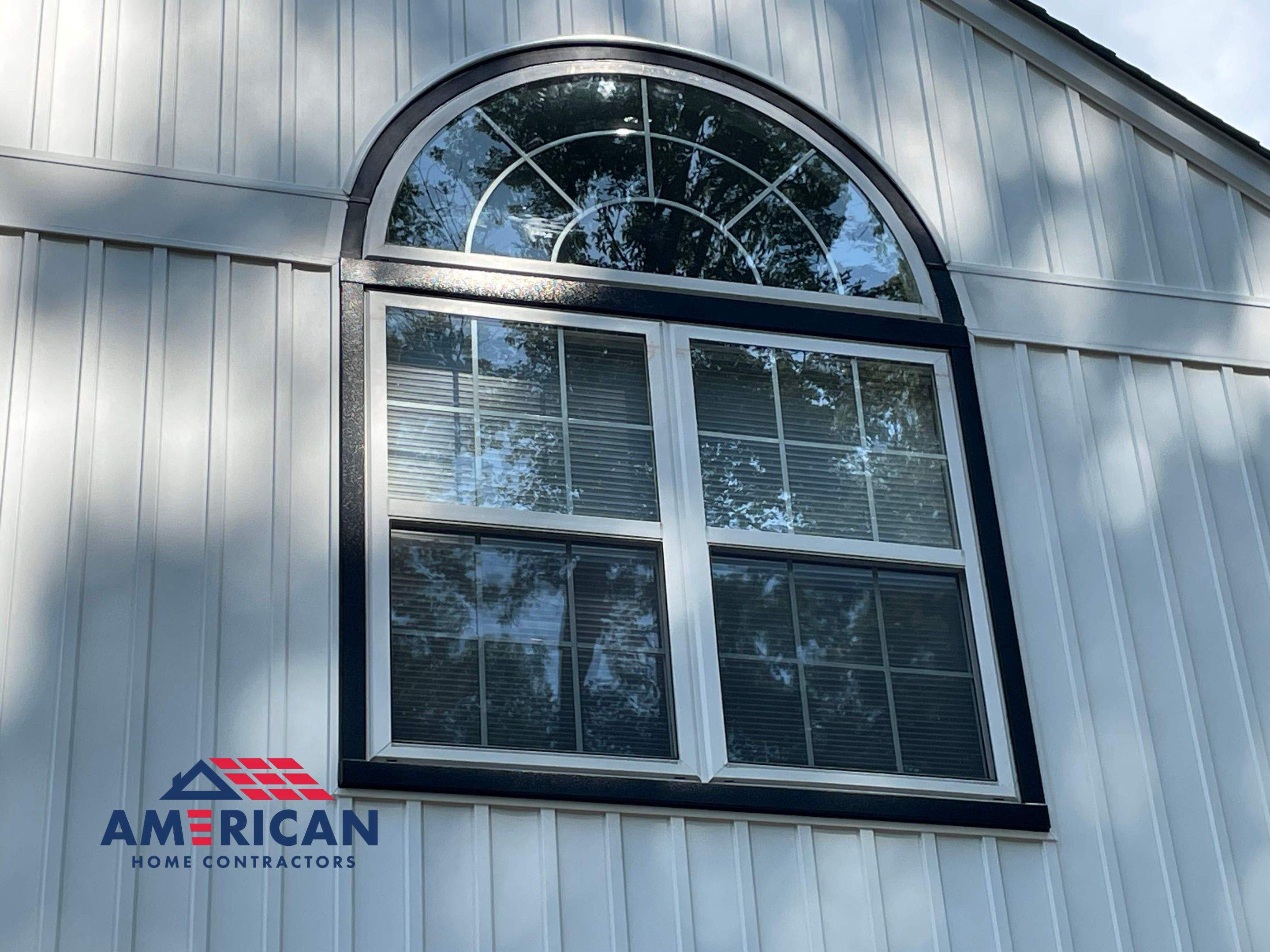 Vinyl Siding Replacement + Black Trim by American Home Contractors