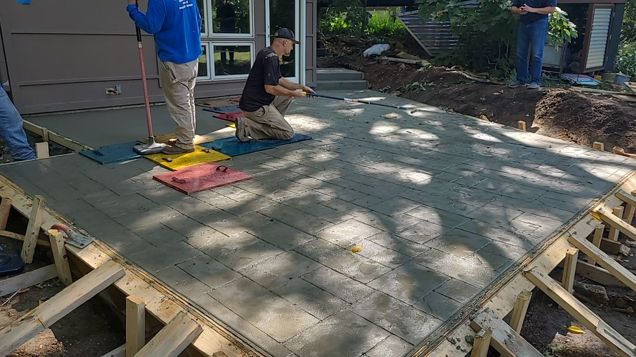Back Yard Cantilivered Patio by LAND ESCAPES LLC