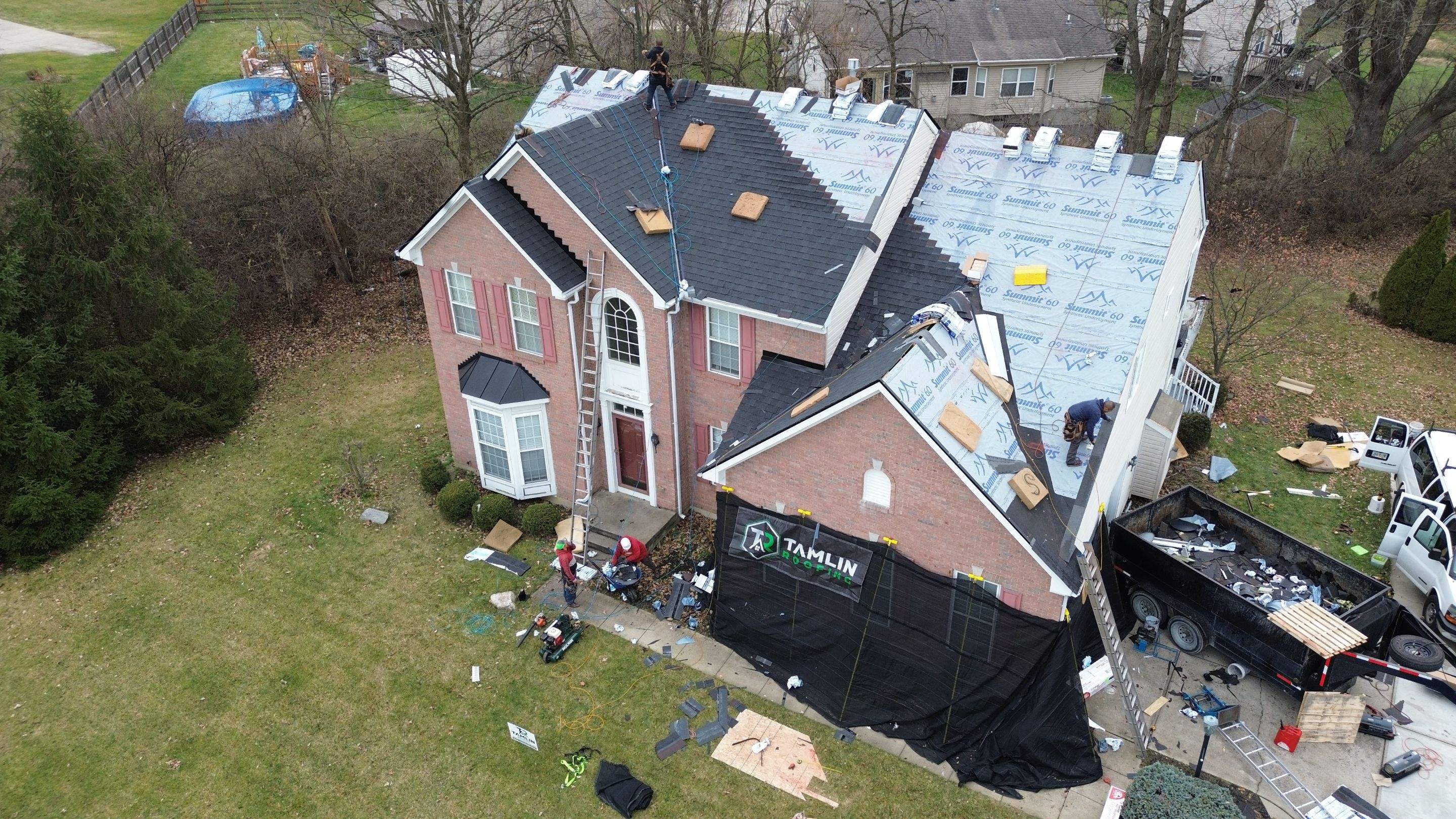 Walden Ponds - Pristine Black and Hydro Flo Gutter Guards by Tamlin Roofing