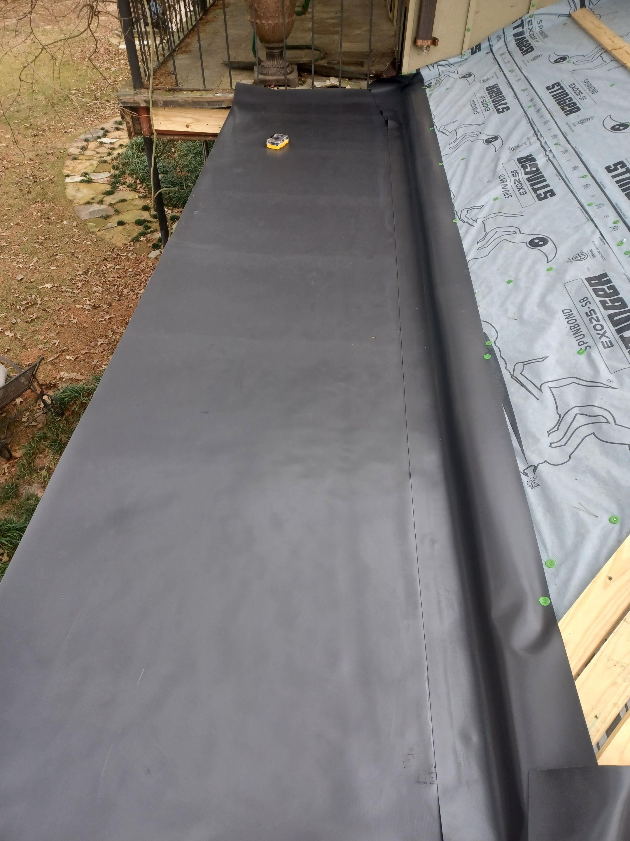 Residential Roofing Installation using PVC membrane and 24 gauge Standing Seam Metal by Hostetler Roofing