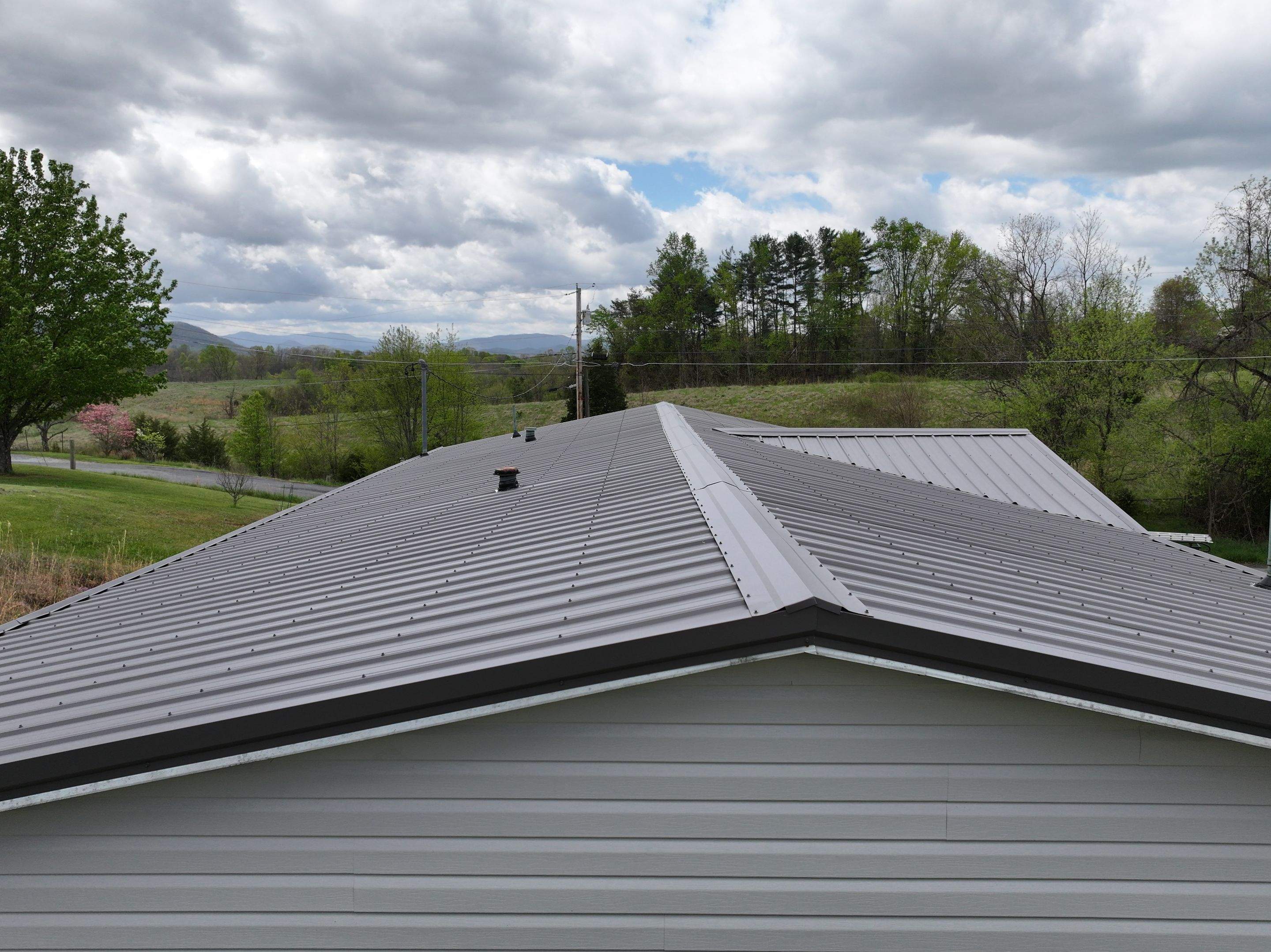 Charcoal Gray Textured Metal Roof by Omnia Roofing
