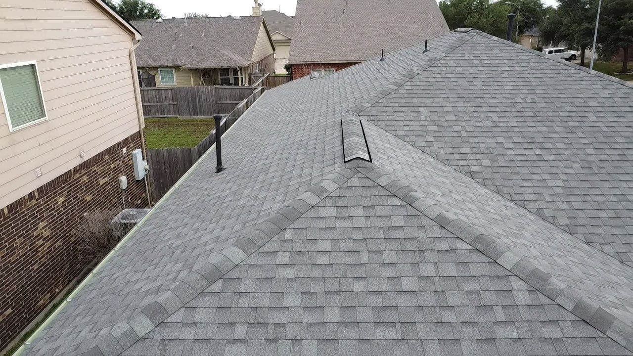 Reroof and Gutter Project in Houston by Roofing Technologies Unlimited