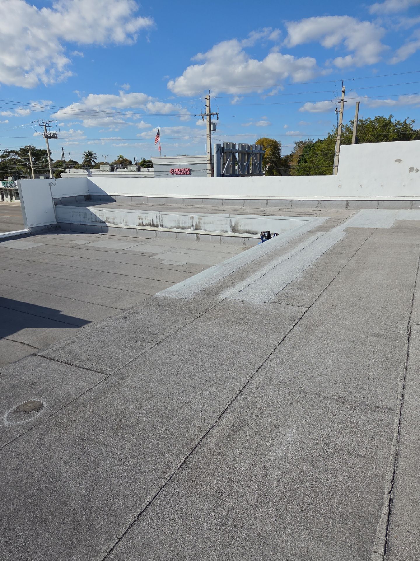 Commercial Flat Roof Restoration Using Silicone Coating in Hallandale Beach by Aastro Roofing