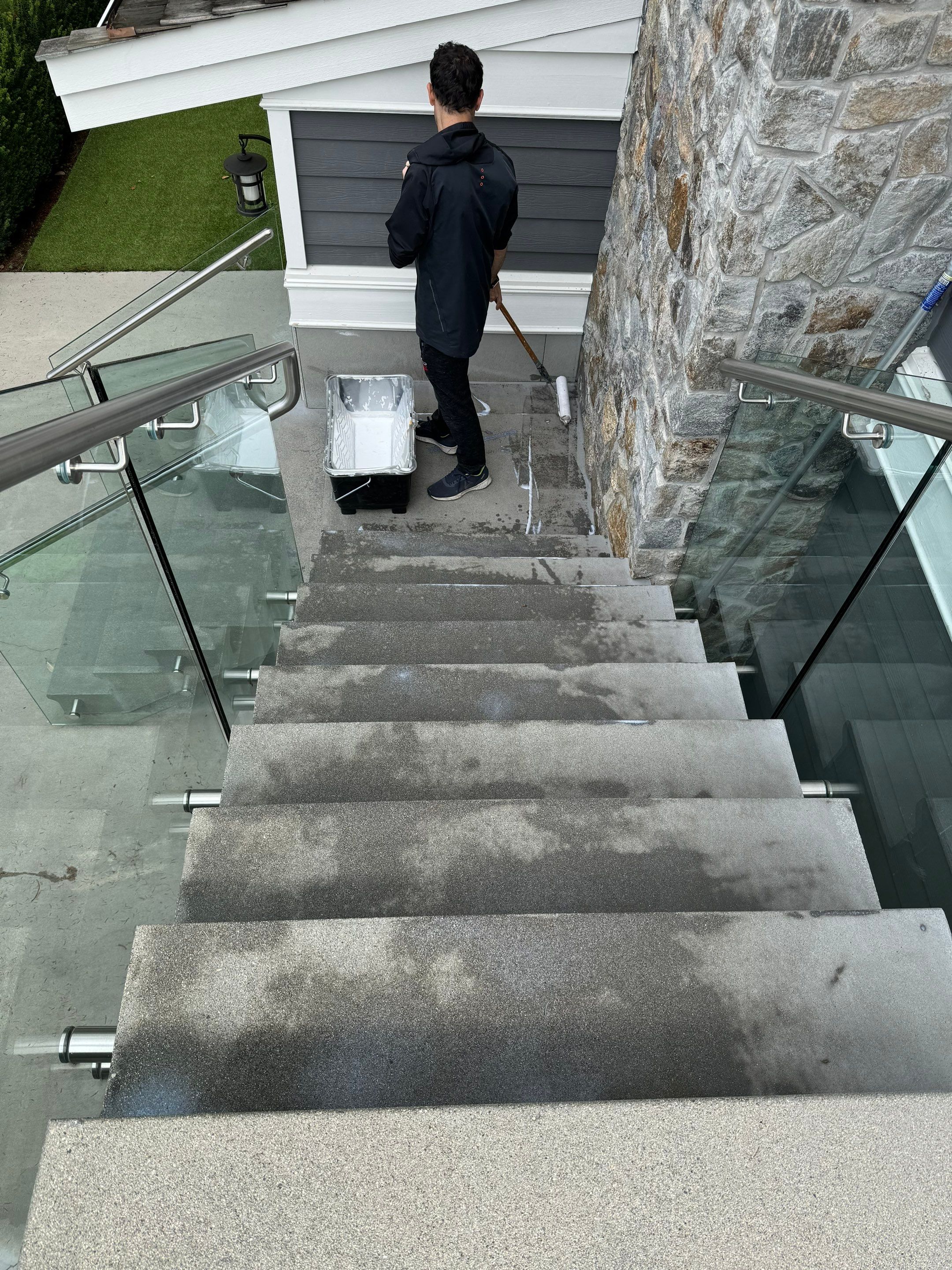 Applying Concrete Sealer  by YVR Construction Group