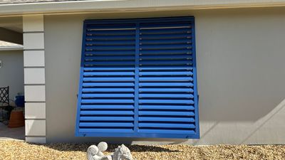 Hurricane Rated Bahama Shutters in Violet Blue / Motorized Bug Screen