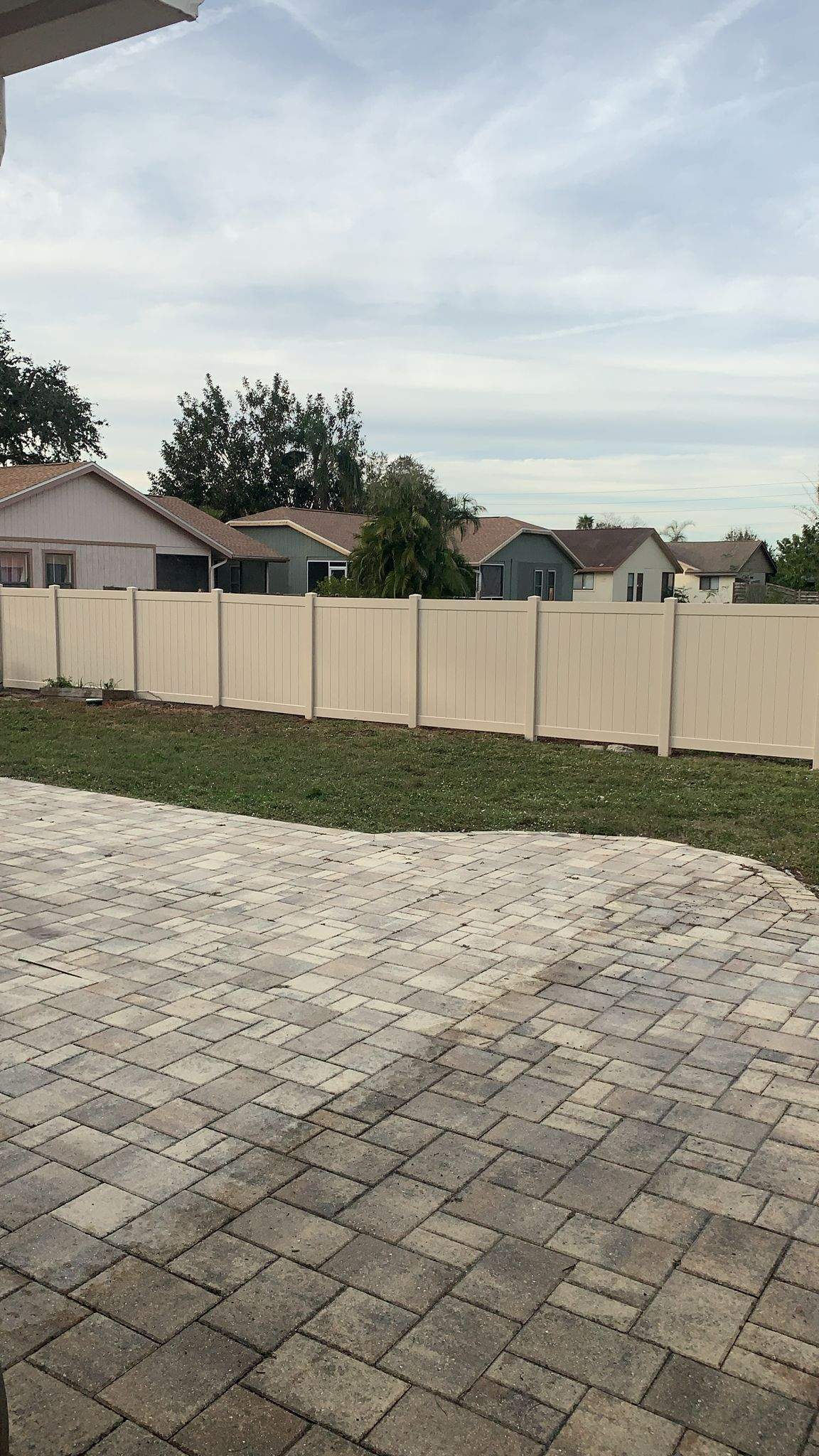 Vinyl Privacy Fence and Custom Paver Patio Installation in Lehigh Acres by True Fence LLC