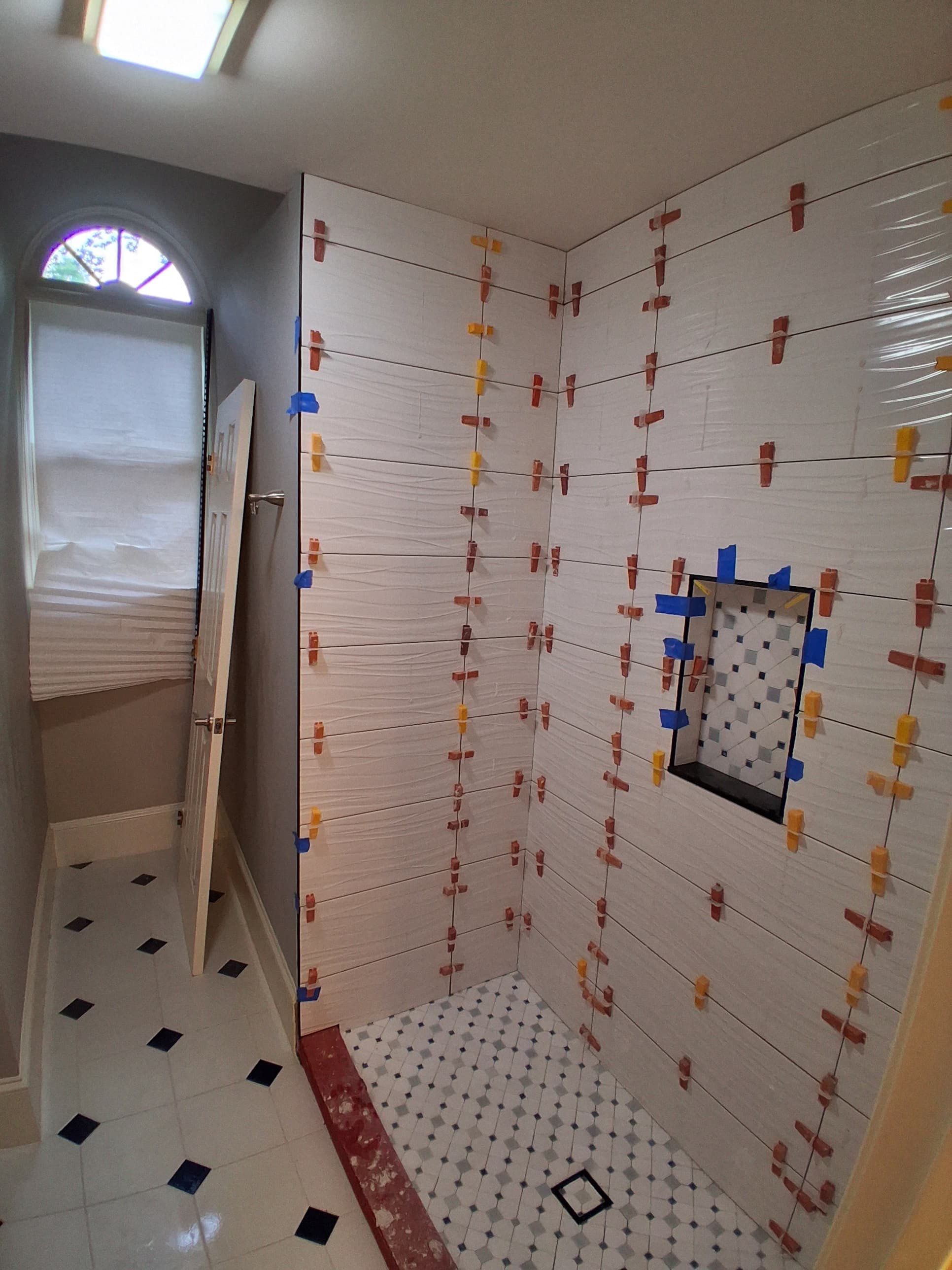Tub to walk-in shower conversion using Glass door by Prudencio