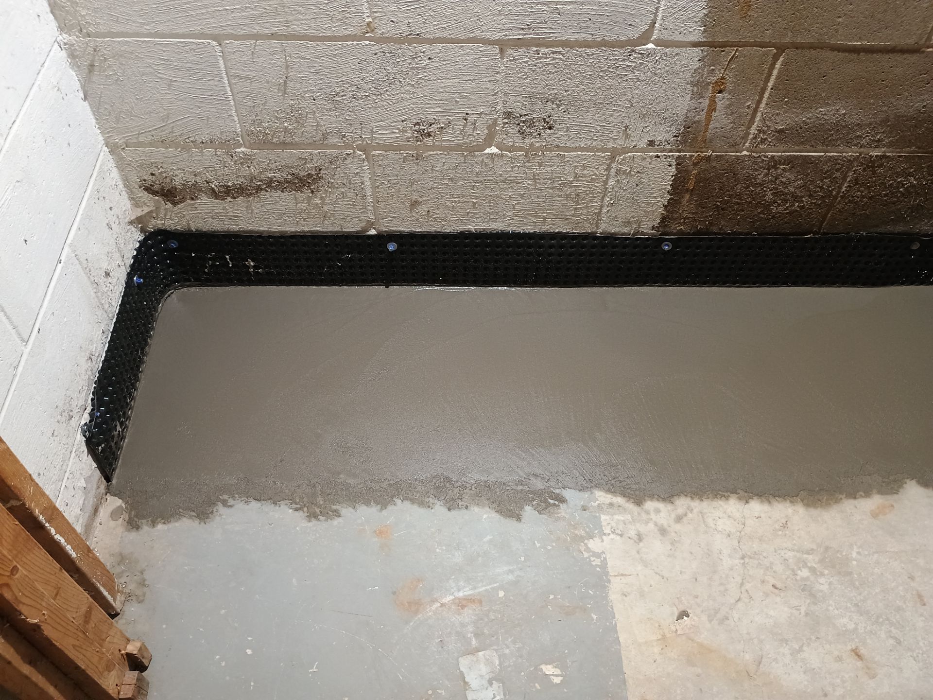 Interior Drain Tile Installation near Columbia Heights, MN by Waterproofing Northeast