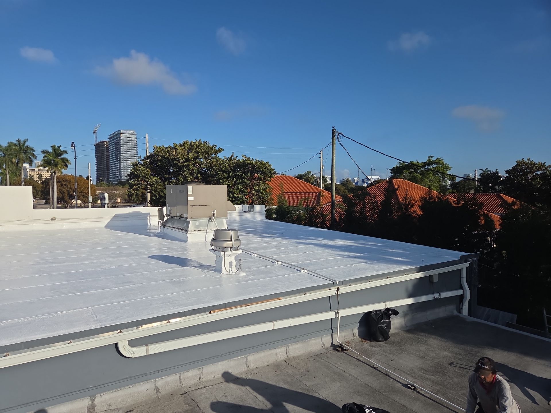 Commercial Flat Roof Restoration Using Silicone Coating in Hallandale Beach by Aastro Roofing