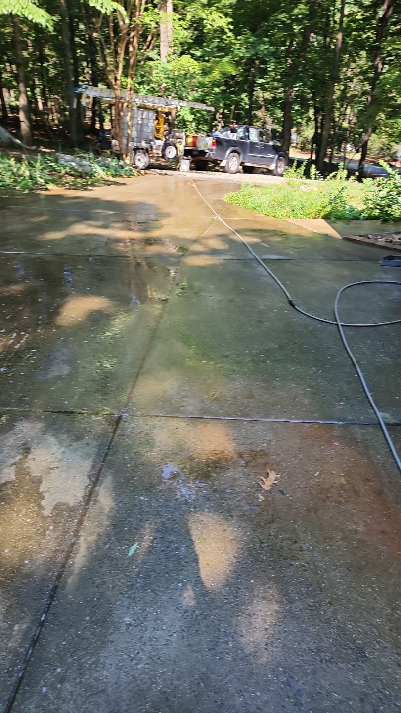 Driveway Clean using cleaner by Power Wash Masters LLC