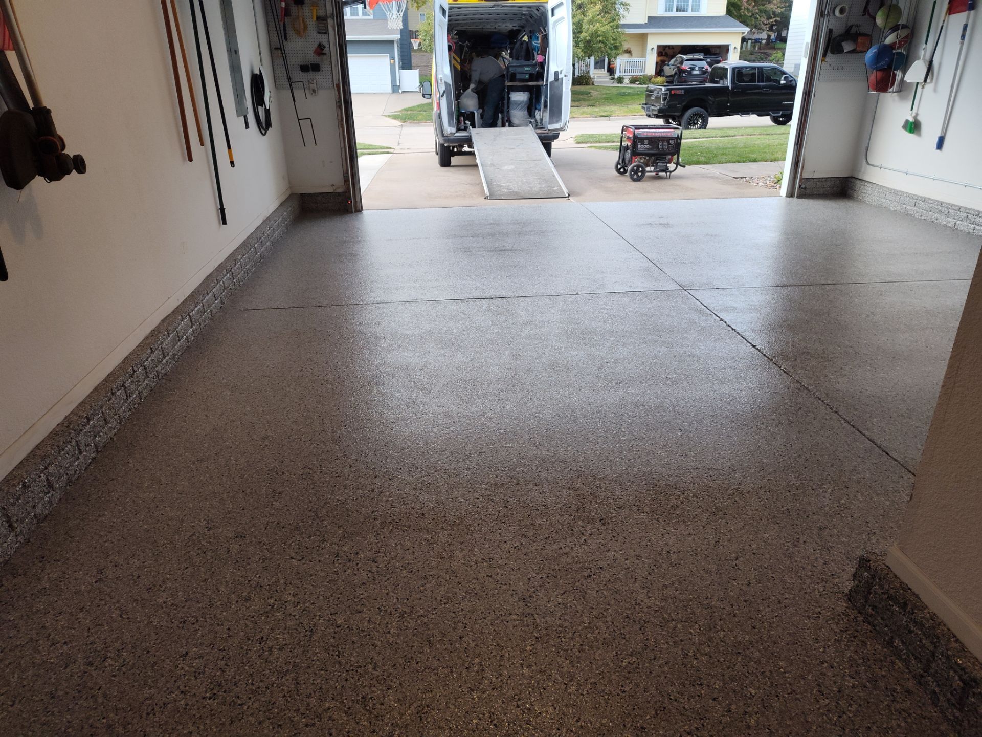 A Garage In One Day Keeps the Rock Salt Away! by Revival Concrete Coatings