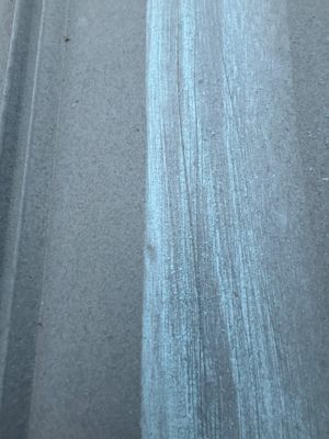 Close up of metal roof surface texture.