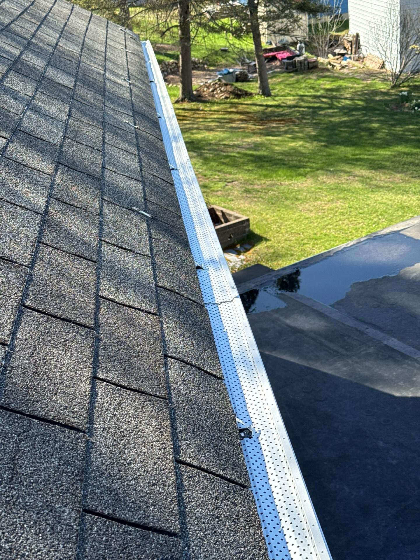 Hybrid Roof Replacement in Pembroke, NH with Owens Corning Peppercorn Shingles, EPDM Rubber Roofing, and Black Metal Ice Belt by Compass exteriors