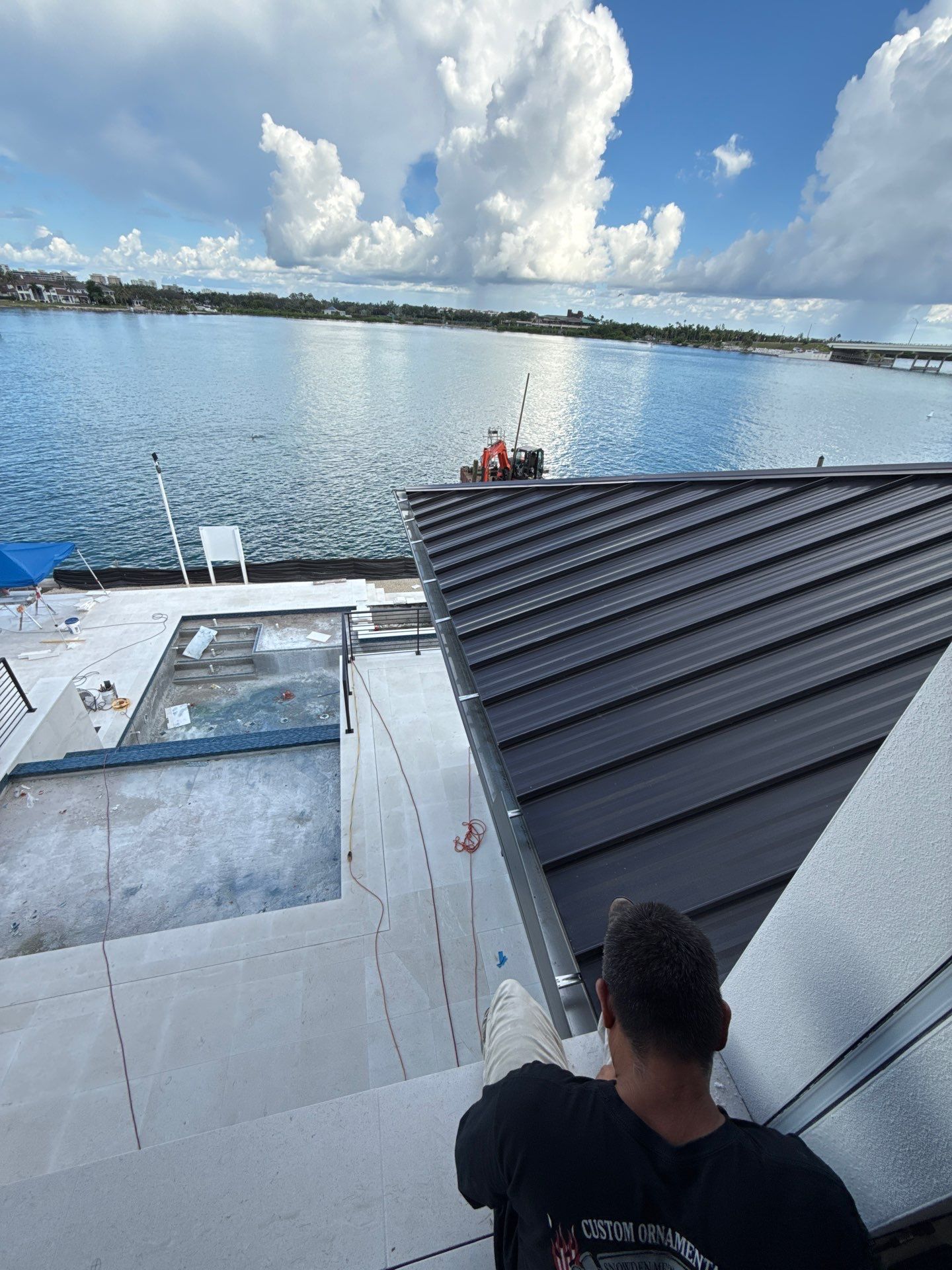 Seamless Aluminum Gutter Installation using black seamless gutters in Sarasota FL by Gutter Professors