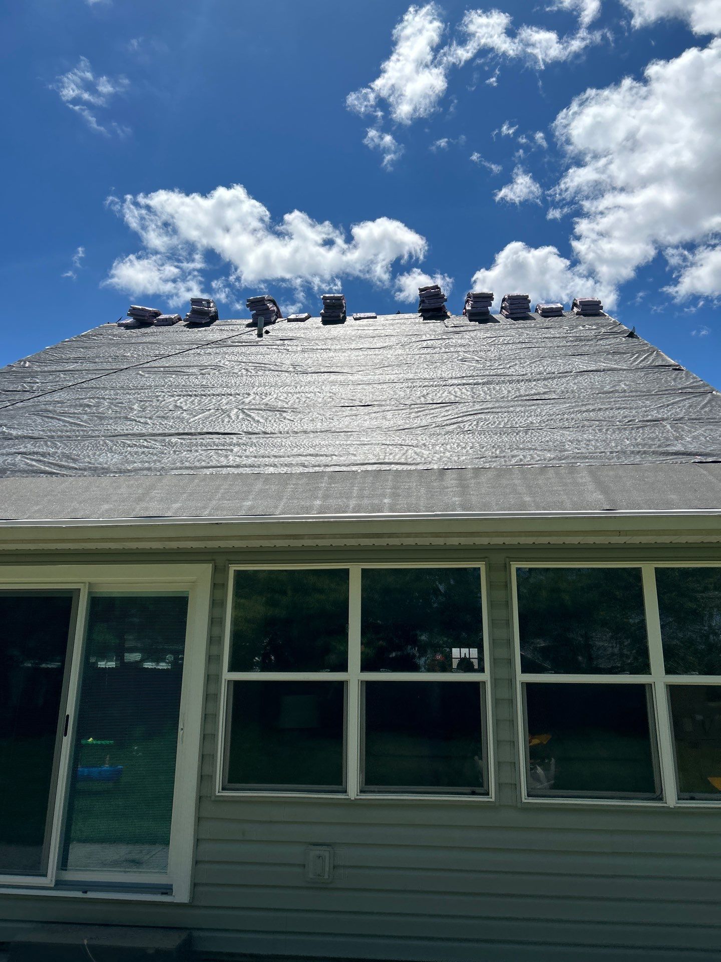 Exterior Installation using Onyx Black Durations and White Siding by WIW Enterprises Inc