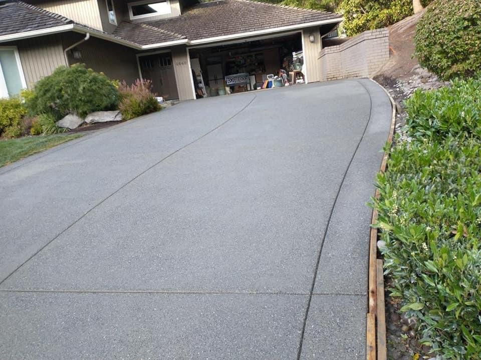 Cristi | Sand Finish Concrete Driveway  by Jireh Asphalt & Concrete Inc 