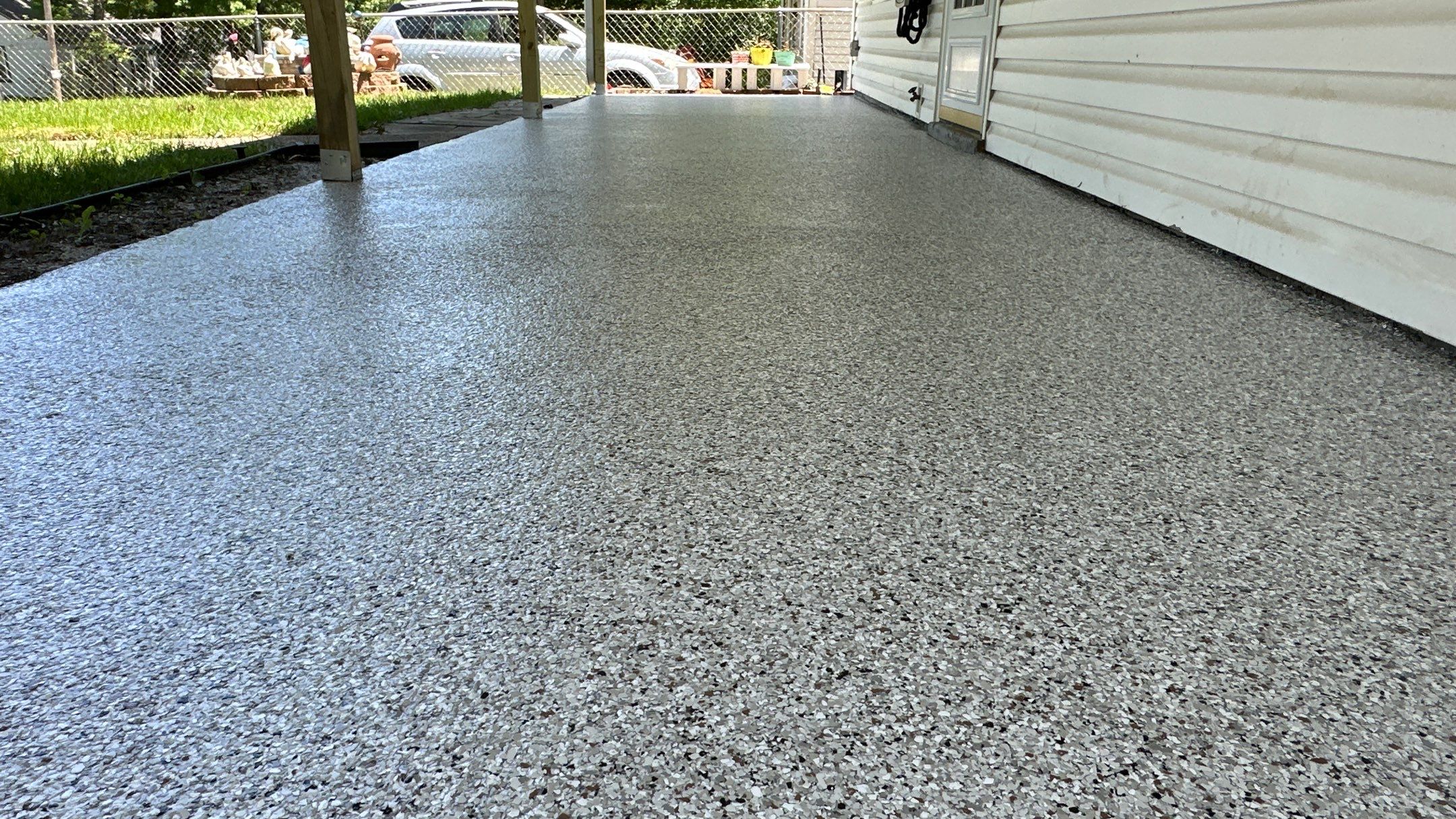 Look at this beautiful Coyote flake floor on this patio by Banner Garage