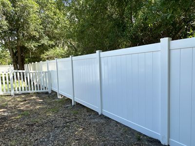 Vinyl Fence Installation using White Vinyl Privacy and Picket Fence