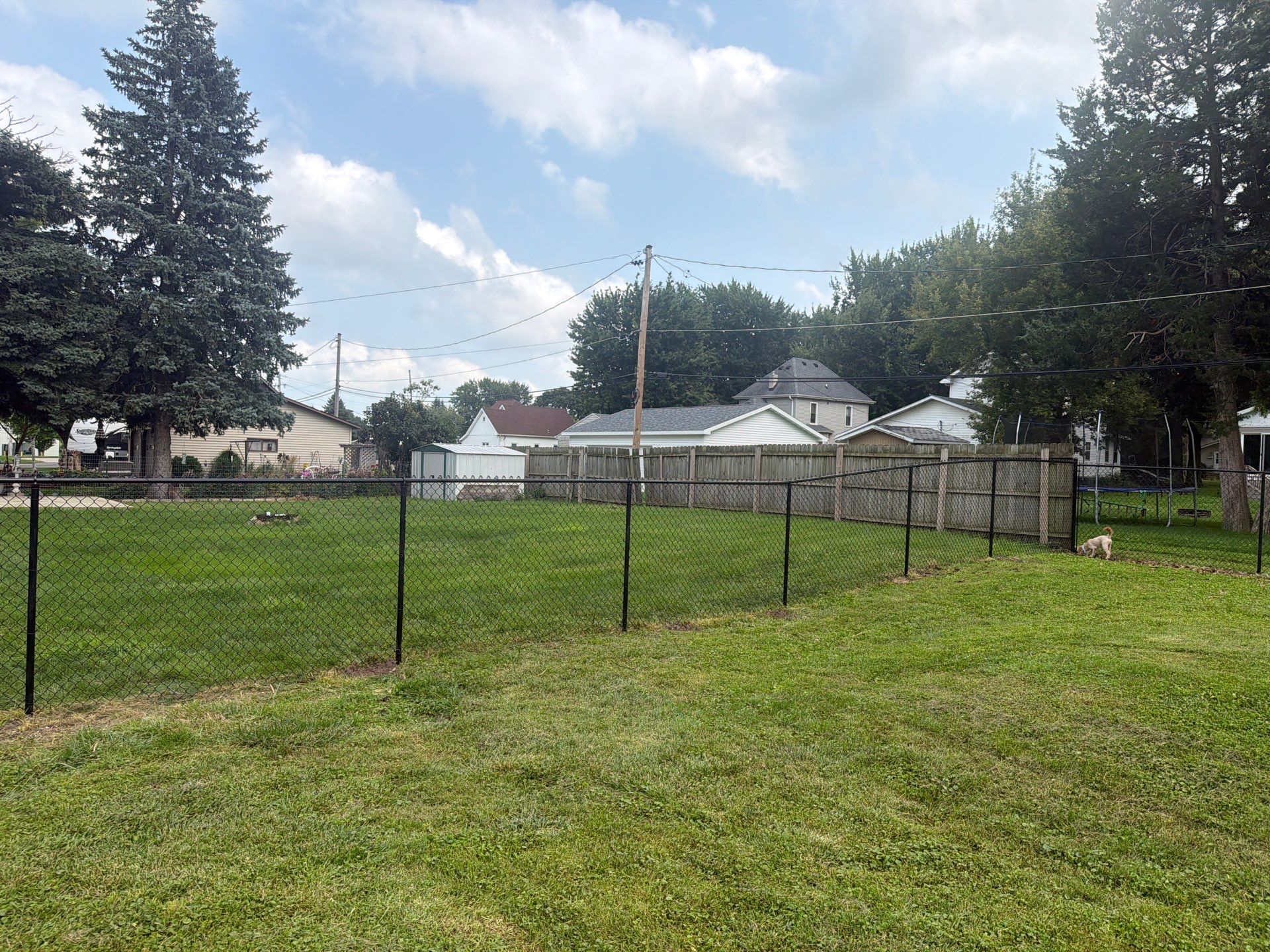 Residential Black Chain Link Fence Installation in Reinbeck by Perfect Picket Fence and Stain