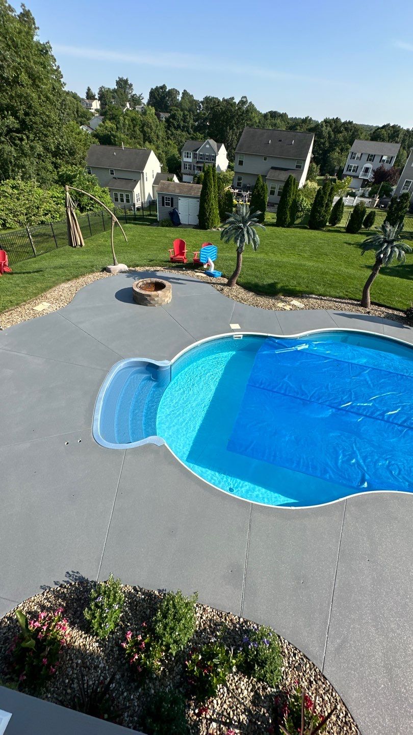 Twilight Pool Deck / Patio Project in Beaver falls by Floors in a Day, Inc