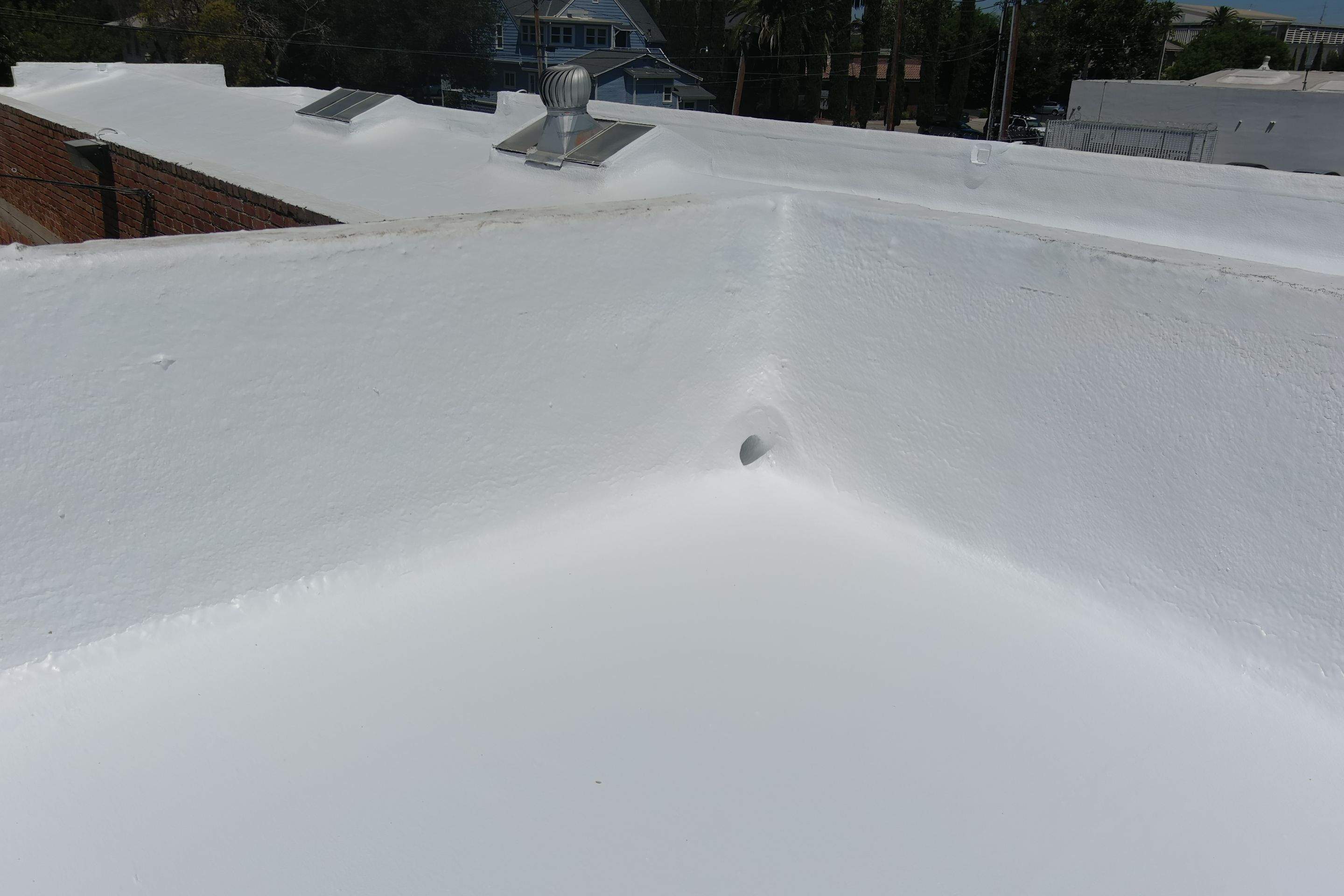 Commercial Roofing Installation using Conklin BenchPly system with PUMA top coat (imbedded fabric system) by Straight Edge Roofing Inc