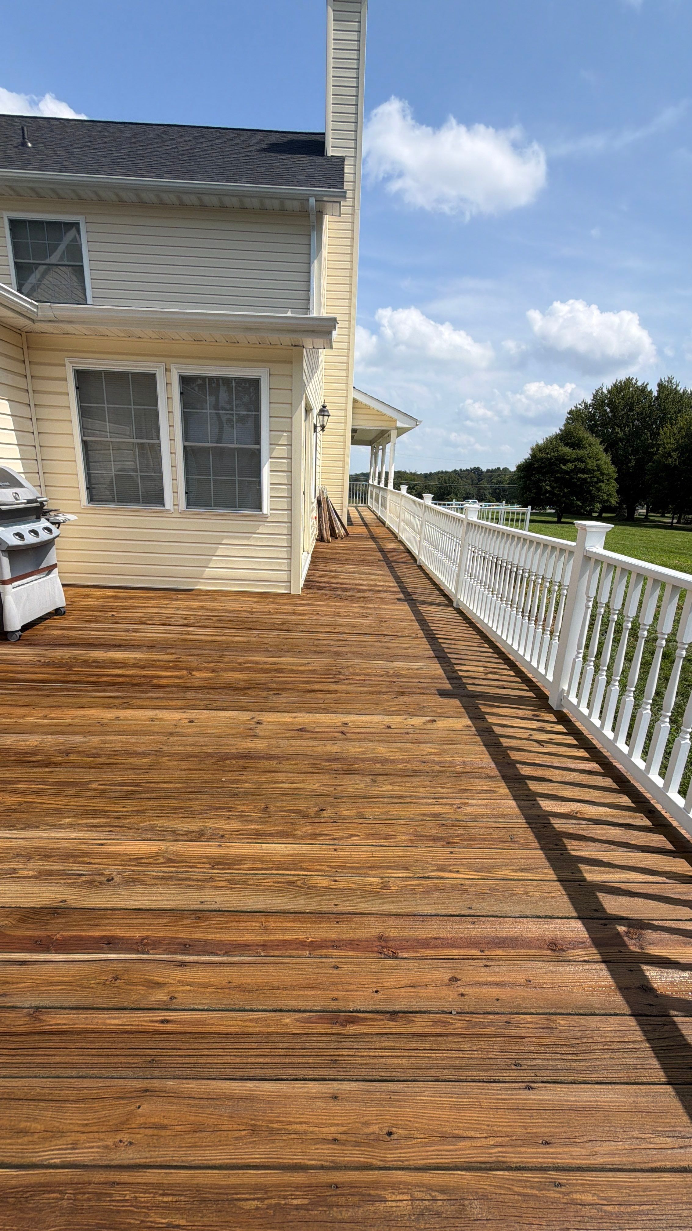 Vinyl Siding House Washing and Wood Deck Restoration in Carroll County by Baltimore Pressure Washers Inc.