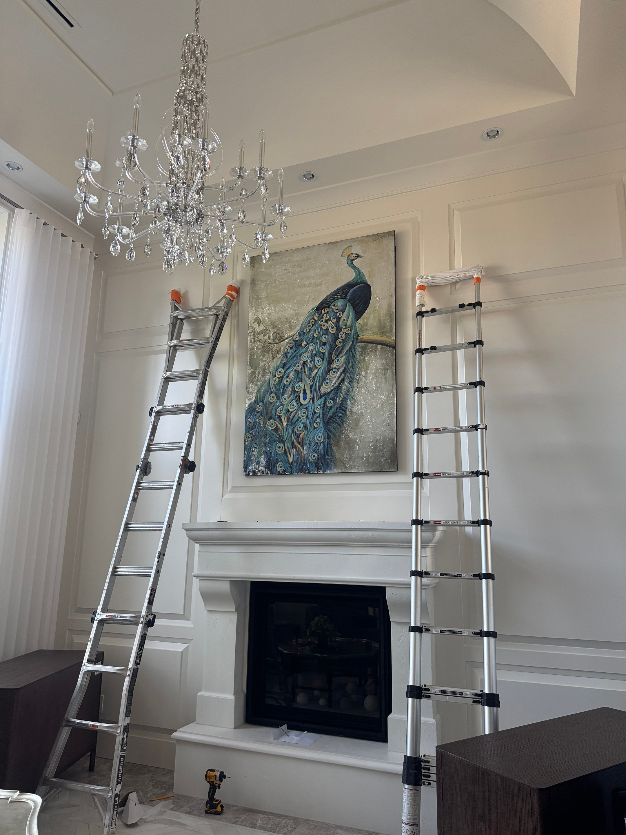 Professional Hanging of Mirrors & Art in a Designer Home by YVR Construction Group