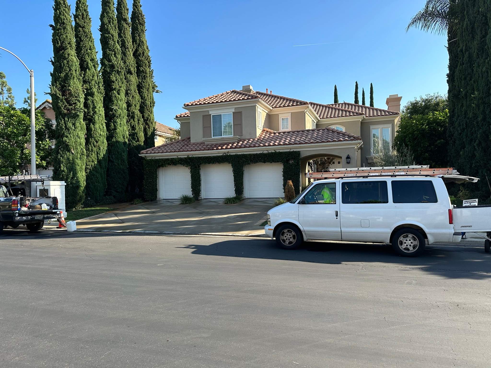 Roof wash on this dirty roof covered in algae by Property Cleaning Experts, LLC