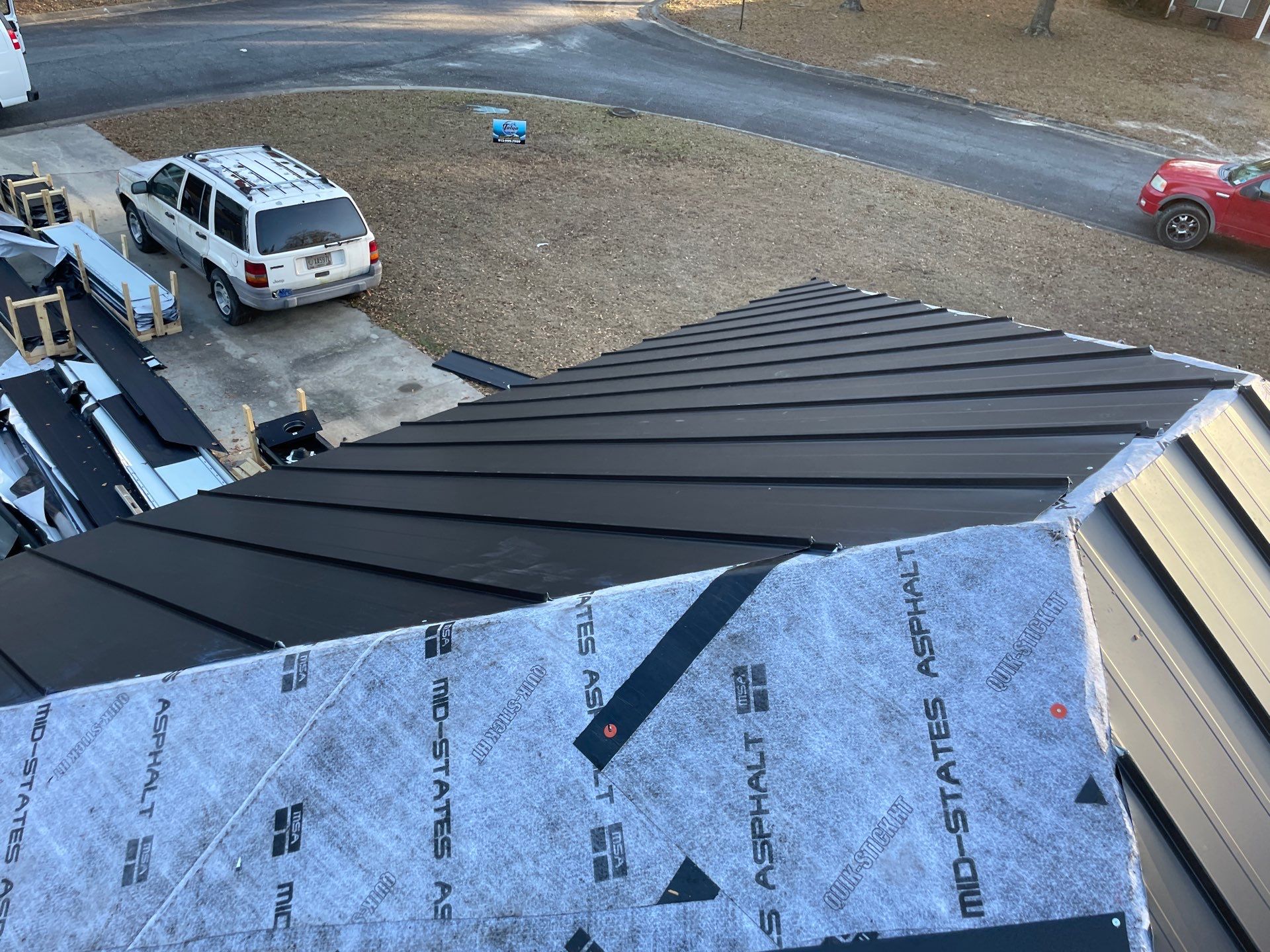 Residential Roofing Installation using Benton 26Ga 1inc Snapcock Metal Roof KYNAR Matte Black by Talya Roofing