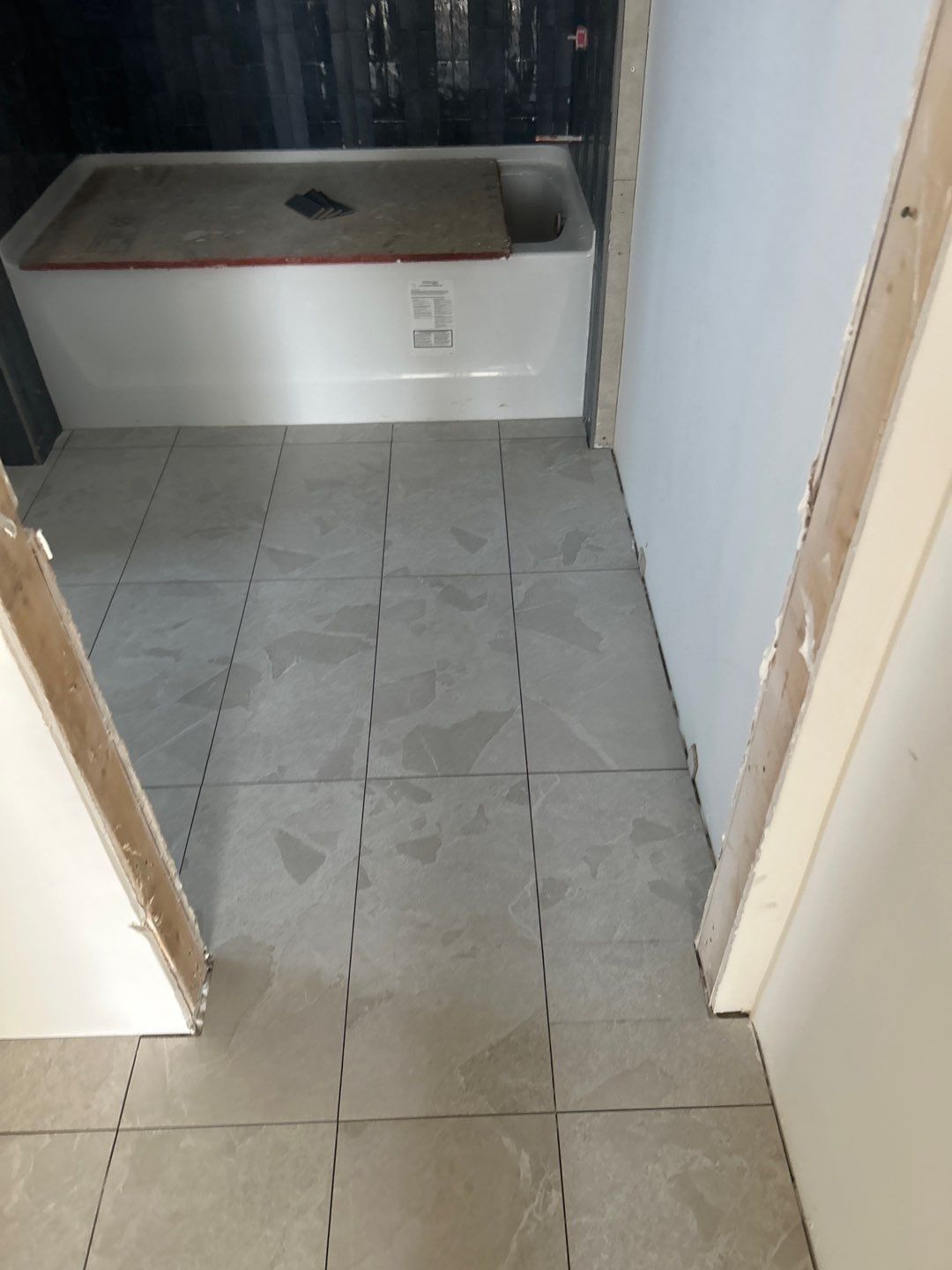 Tile floors, walls, showers, and accent wall for bathrooms  by Footprints Floors of Nashville