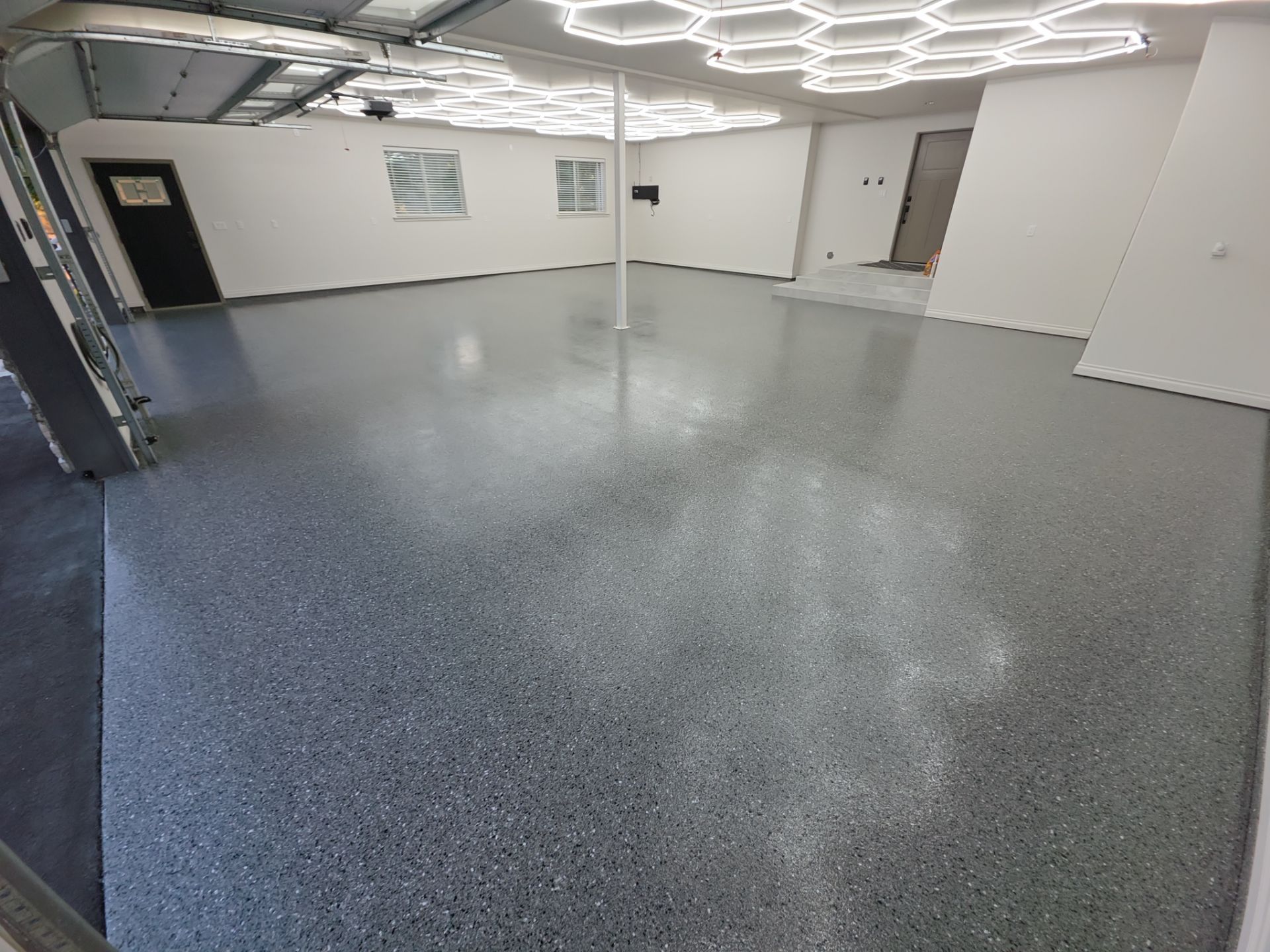 Custom Garage Transformation with Polyaspartic Coating and Hexagonal LED Lighting by Croc Coatings, LLC