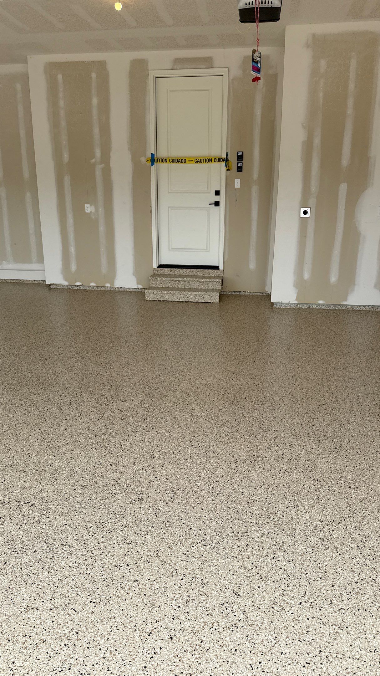 Raymore Garage Finishing With Custom Epoxy Floor Coating by Banner Garage