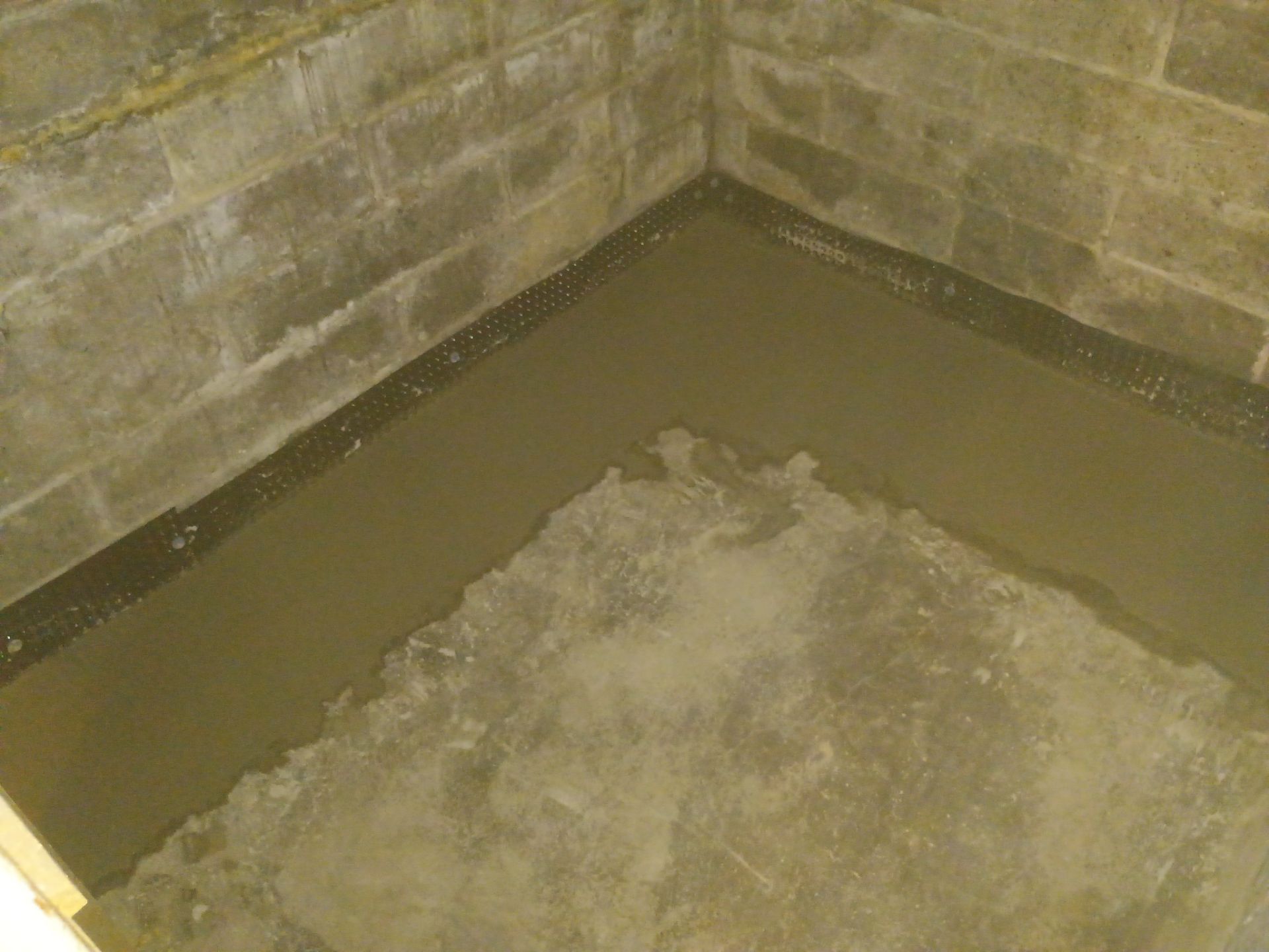 Interior Drain Tile for a South Minneapolis Basement by Waterproofing Northeast