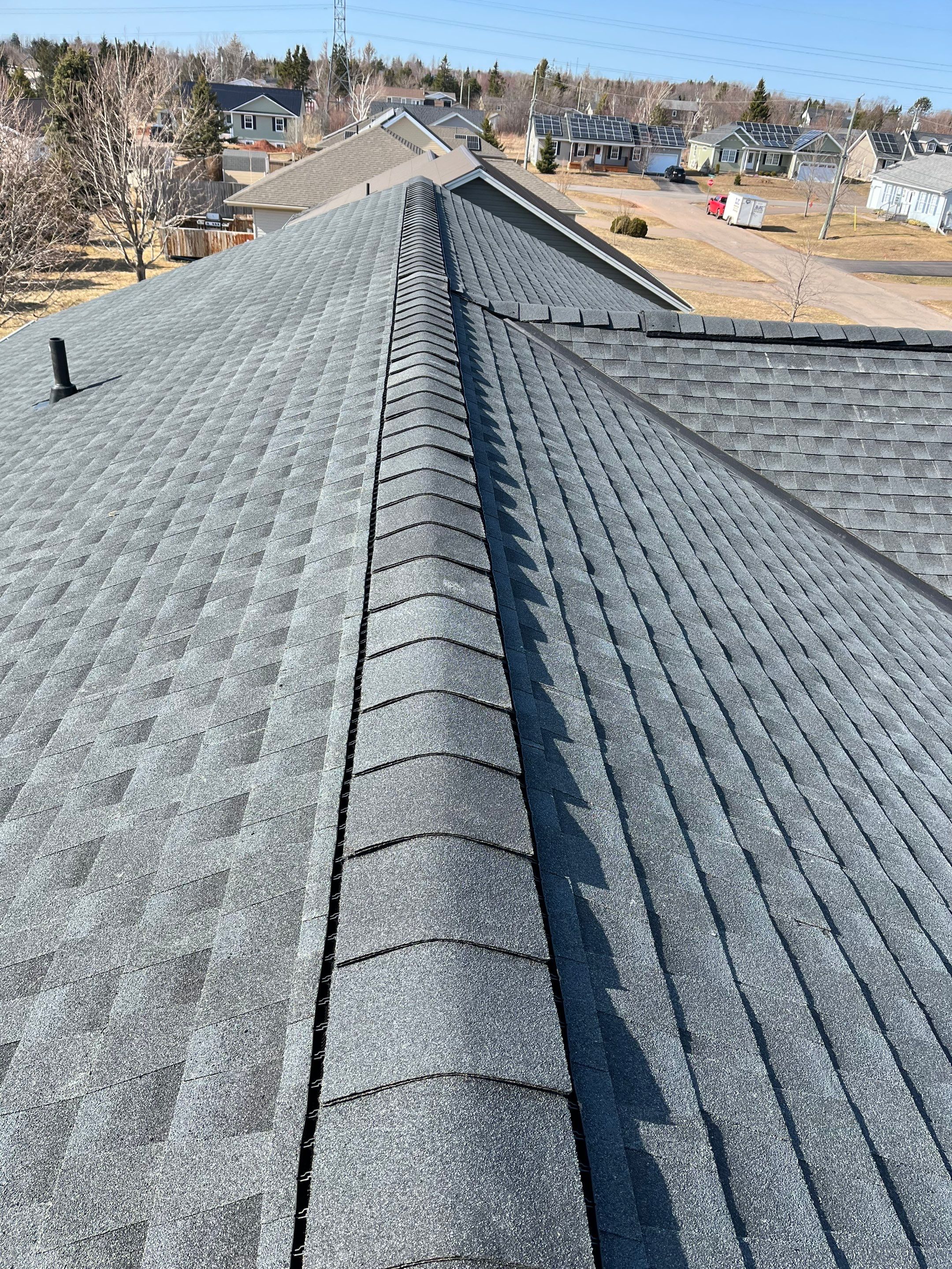Residential Roofing Installation using Asphalt GAF HDZ in Charcoal by Artisan Roofing & Home Improvements Inc.