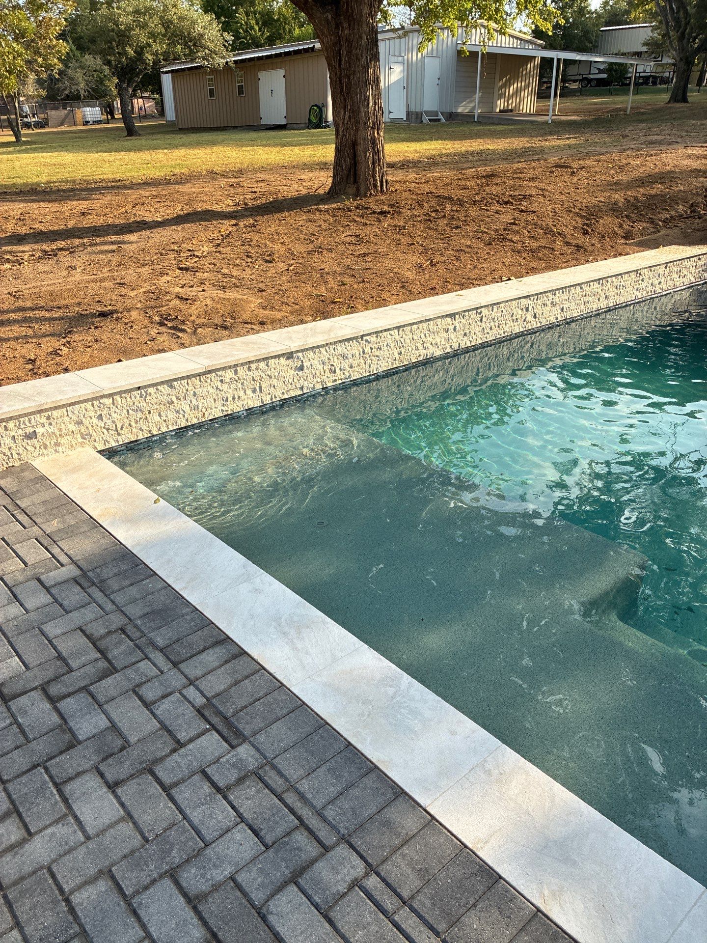 Geometric Pool with Raised Stone Spa by Pinnacle Pools and Spas - DFW