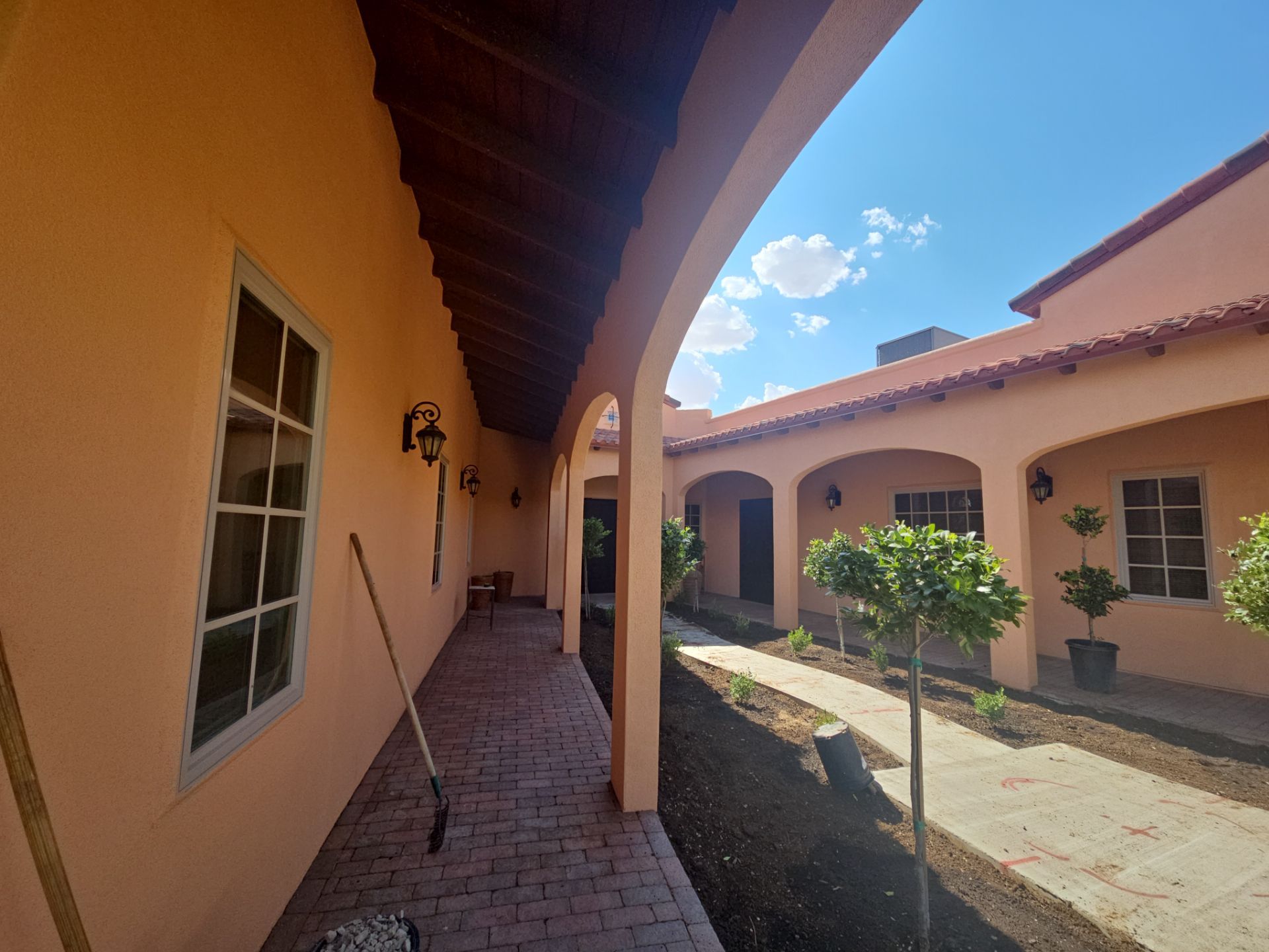 Exterior Painting with Stucco Damage by Regal Renovate