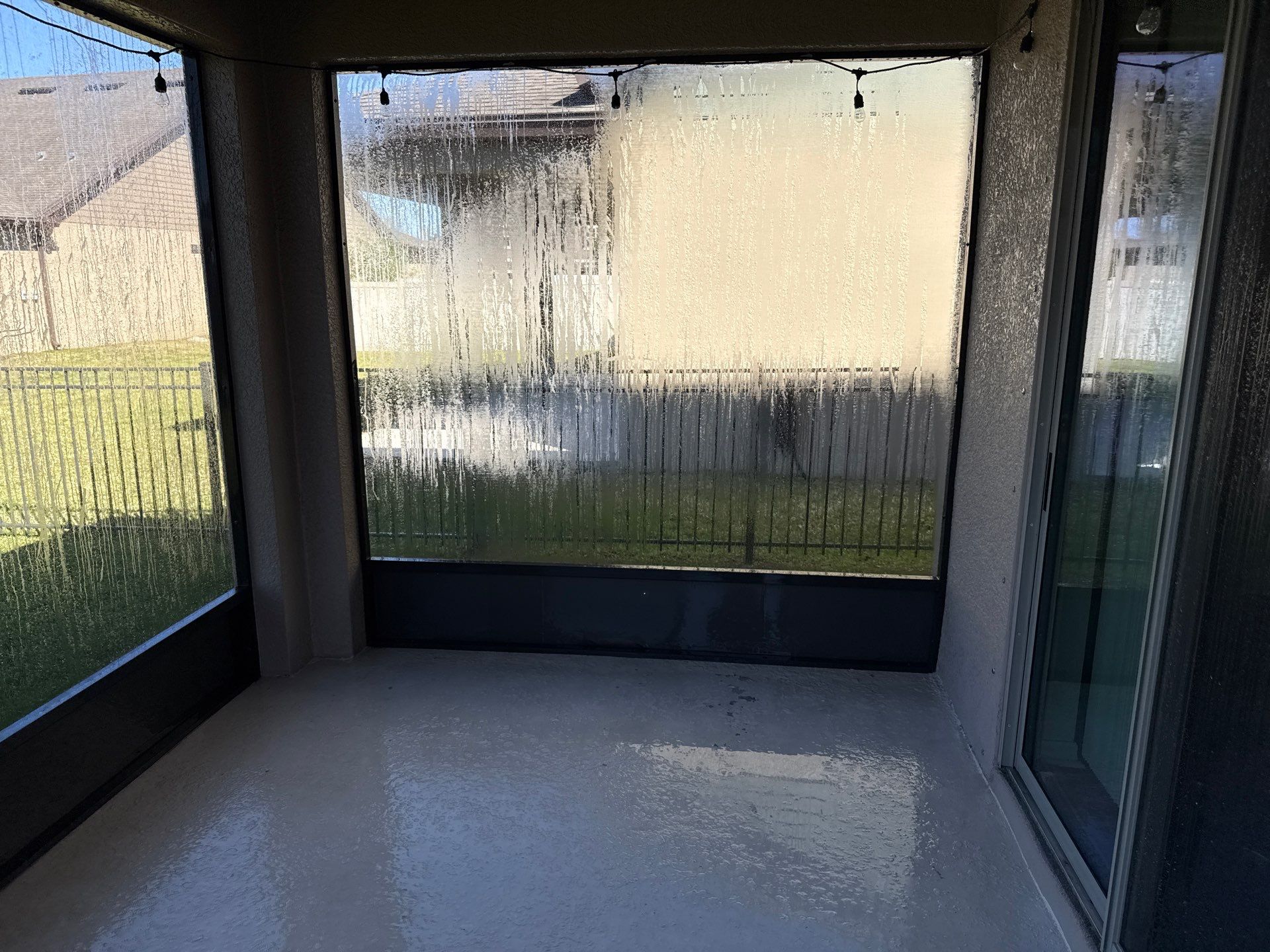Painted Lanai Floor, Screen Enclosure, and Driveway Cleaning in Trevesta Community, Palmetto, FL by Sunshine AquaWash