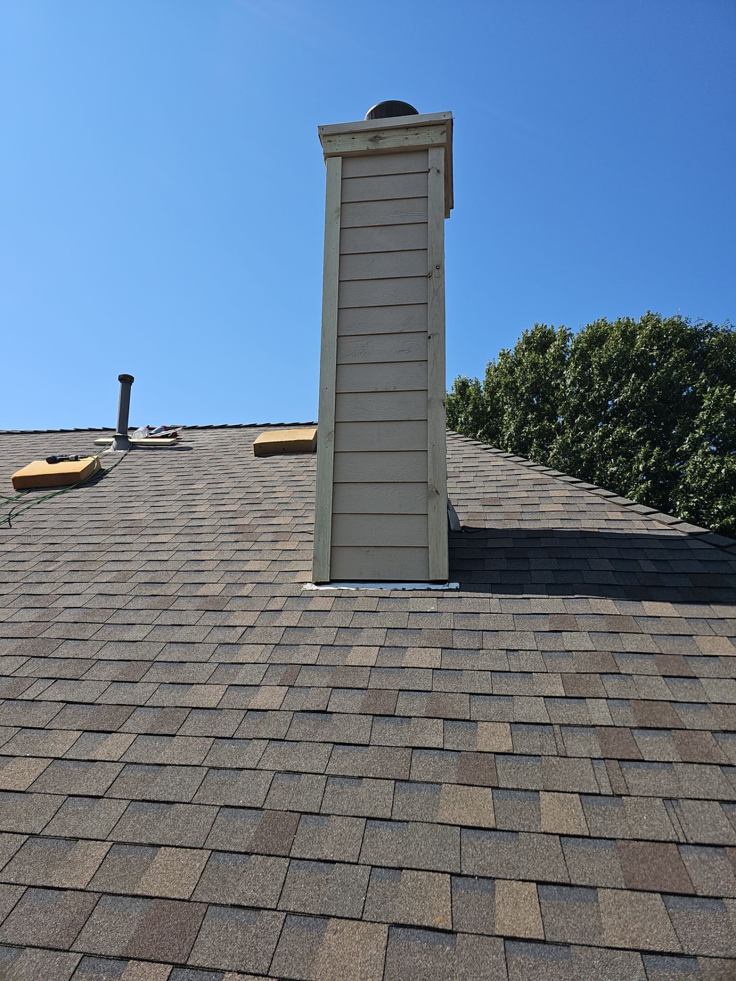 chimney repair using lap engineered treated composite siding. by road roofing llc