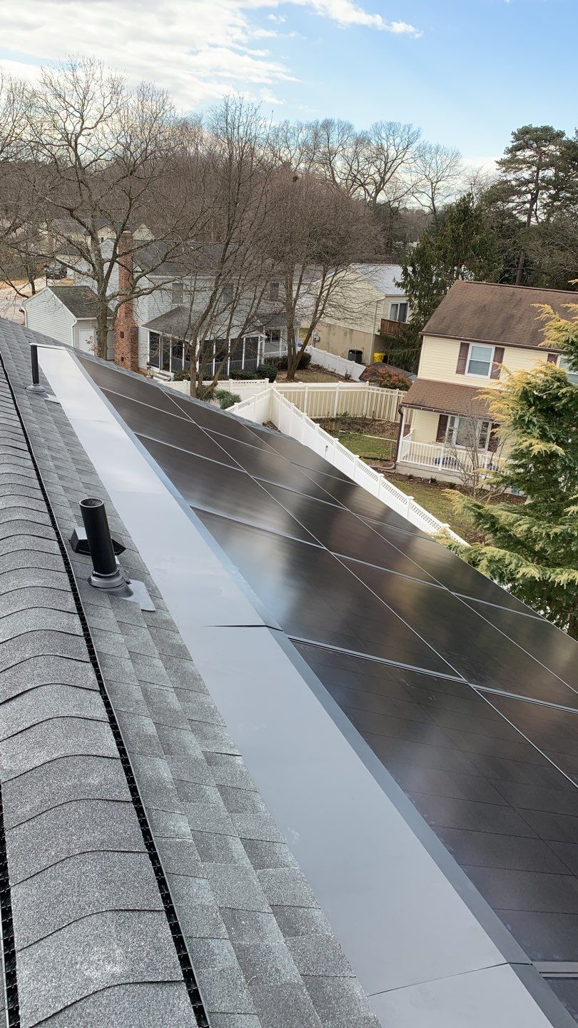 Roof Replacement with GAF Decotech integrated solar panels by American Home Contractors