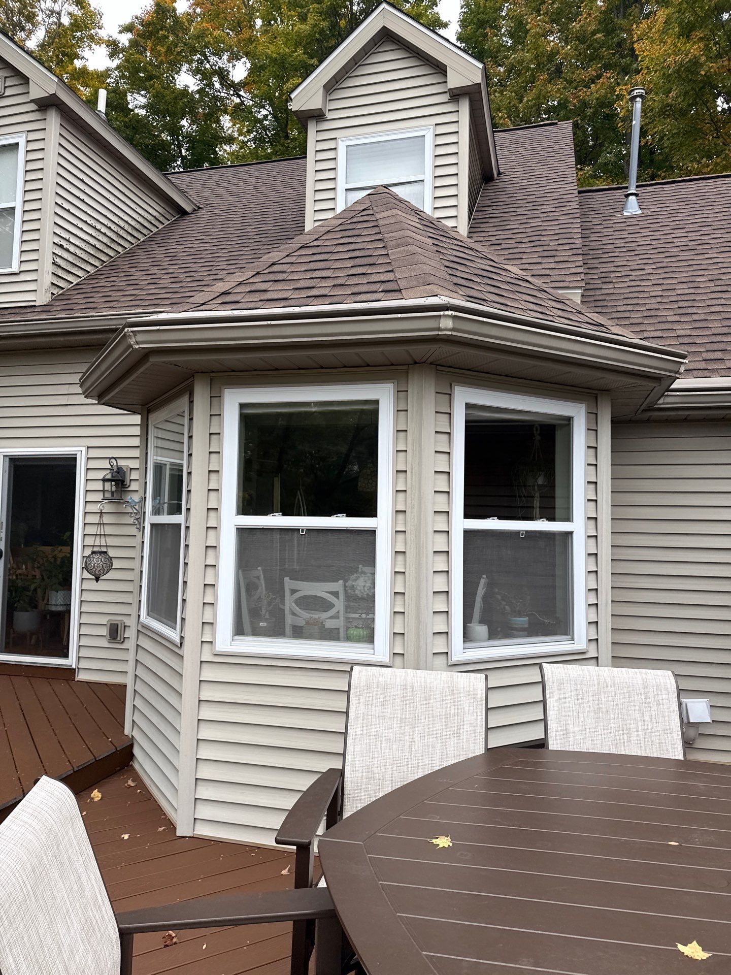 Traverse City Gutter Helmet Installation on a Shingled Roof Home by Rainbow Seamless Systems