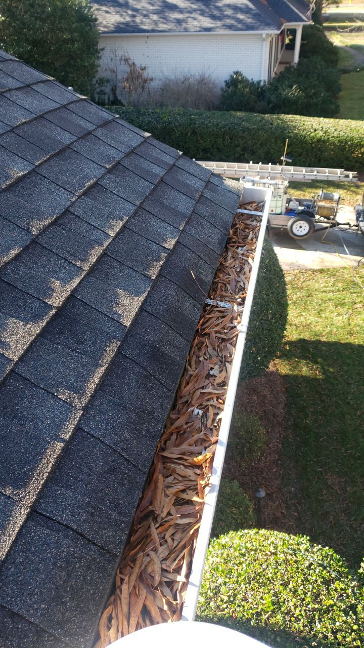 Sara Gutter cleanout using water by Power Wash Masters LLC