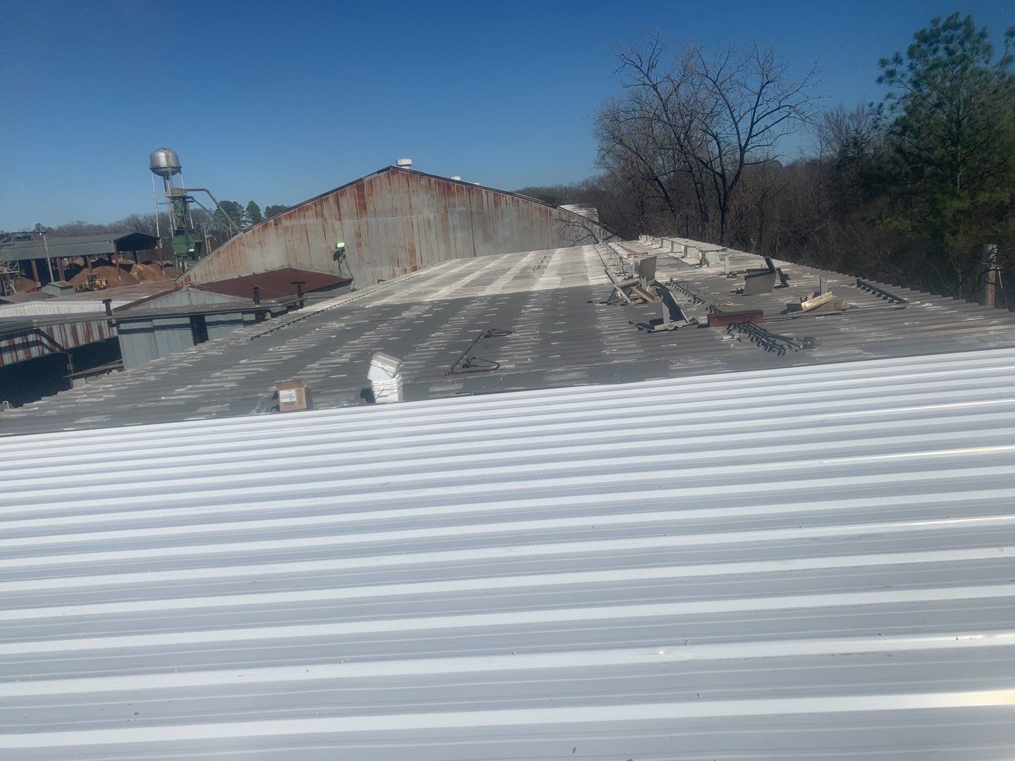 Commercial Roofing Installation using Aluminum Roofing panels by Hostetler Roofing