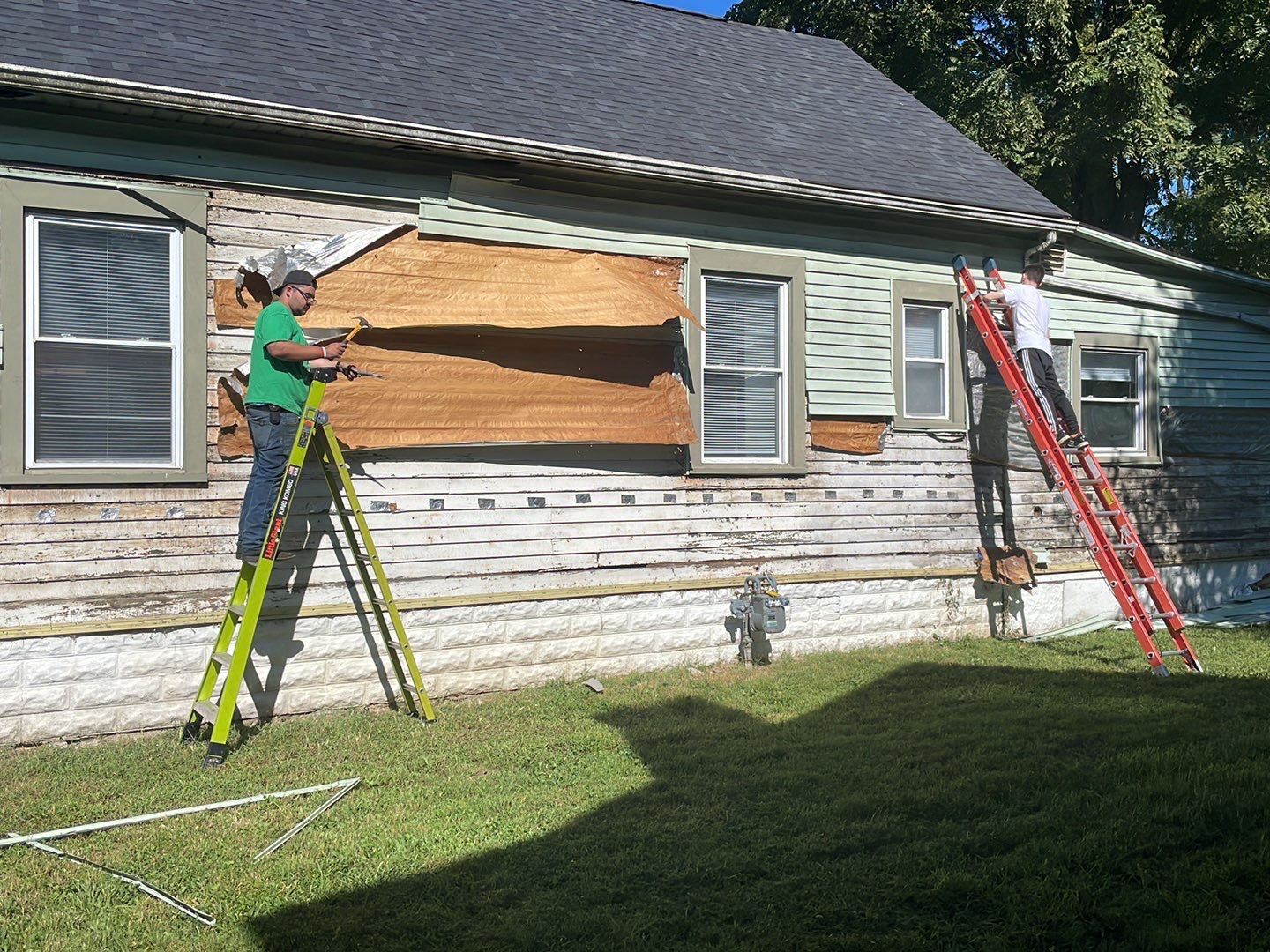 Rental Property Restoration, siding, flooring, gutters, landscaping by Storm Contracting 