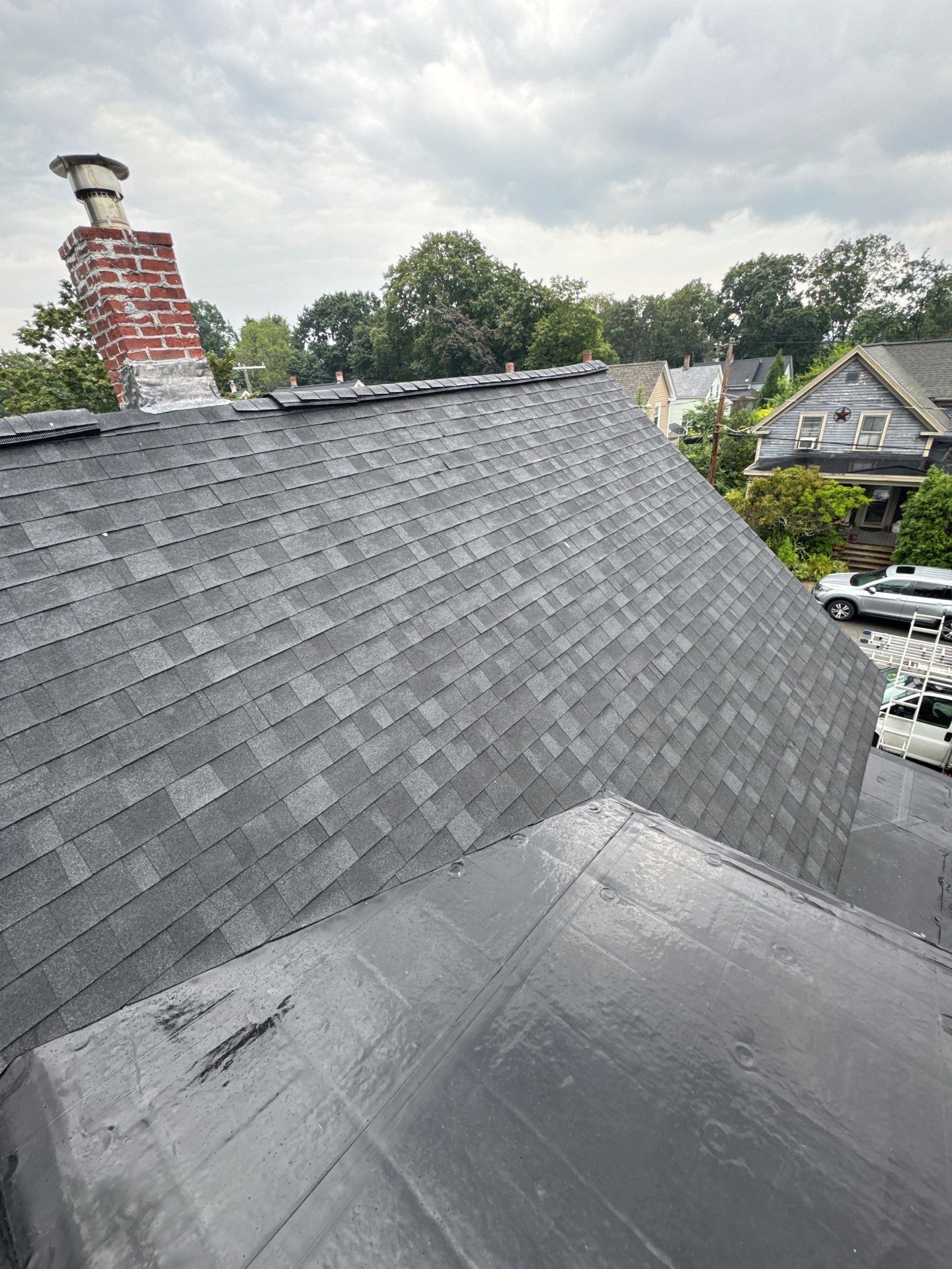 Full Roof Replacement + Custom Gutter Install | Onyx Black Finish by Mighty Dog Roofing of Greater Middlesex County